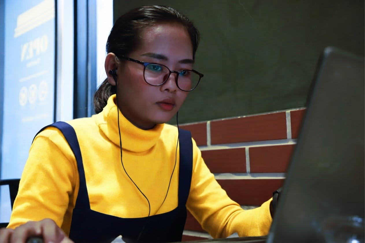 Image of a woman on a computer.