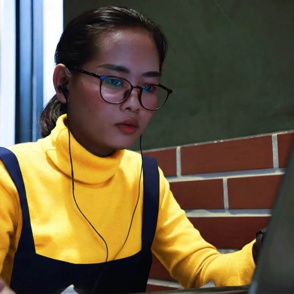 Image of a woman on a computer.