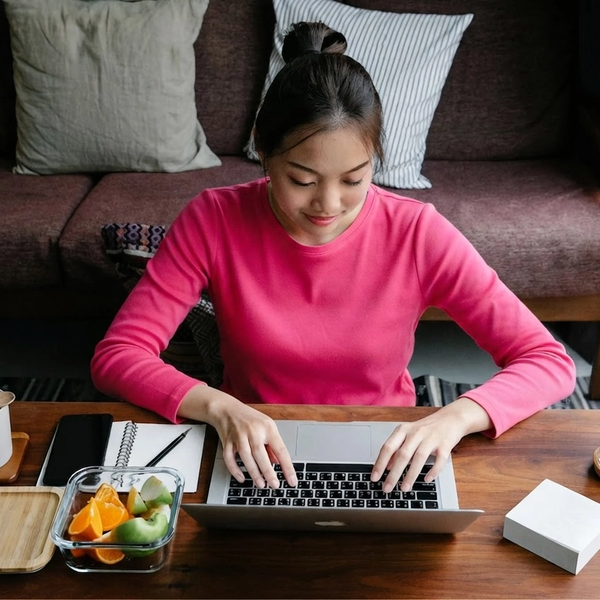 Image of a woman on a computer.