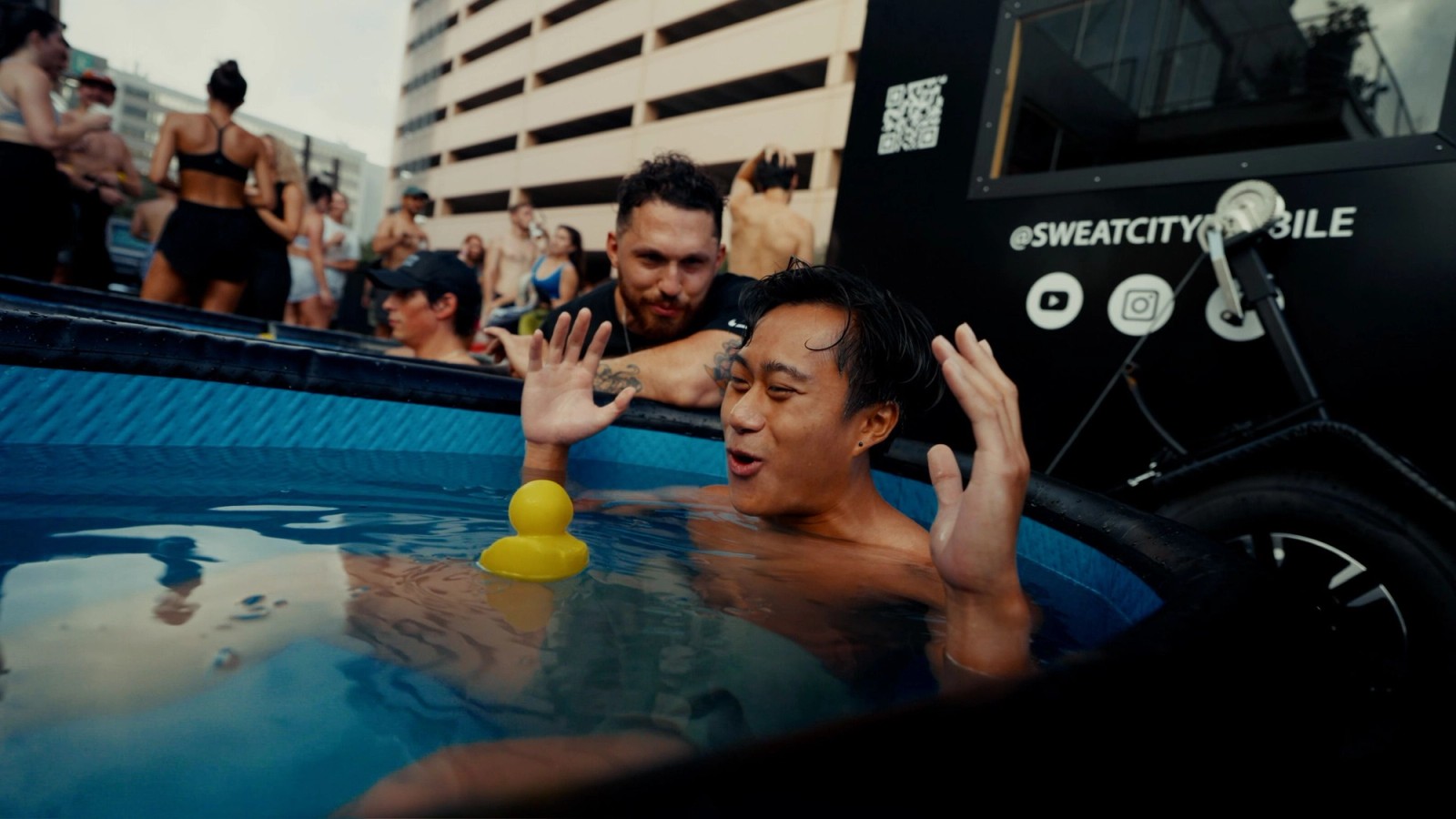 A close-up view of an individual breathing deeply while immersed in an outdoor cold plunge ice bath tub