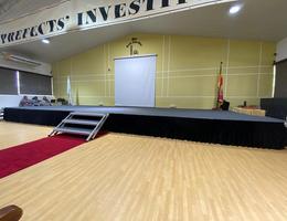 Carpeted auditorium stage setup