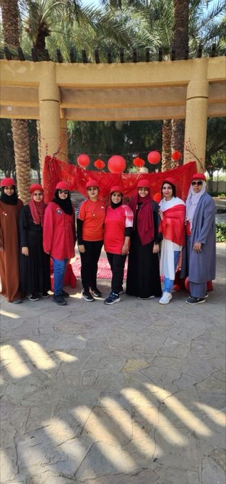 Dubai chapter members at a red-themed outdoor meetup