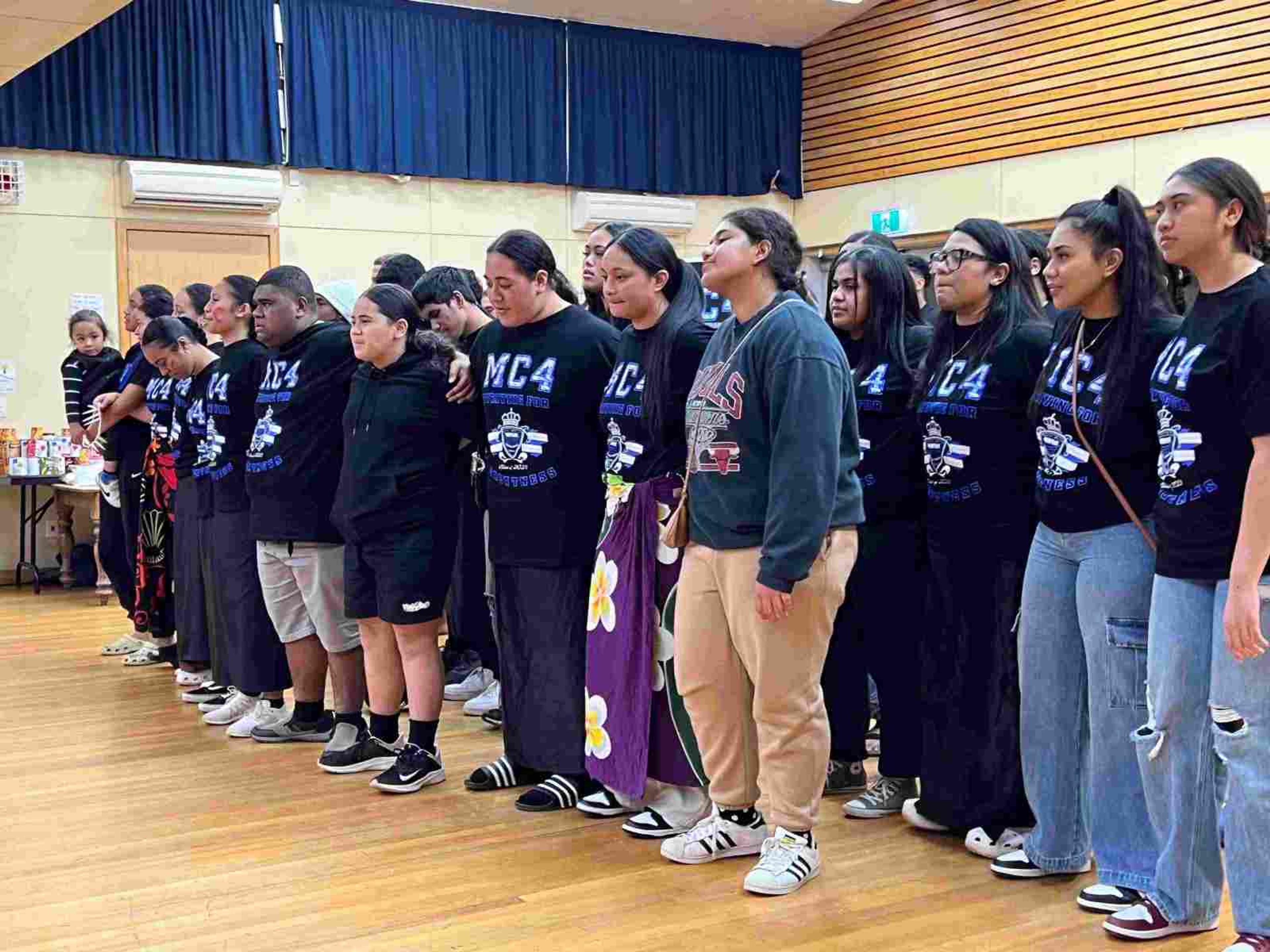 ​MC4 students singing a hymn at the Avondale Community Centre. 