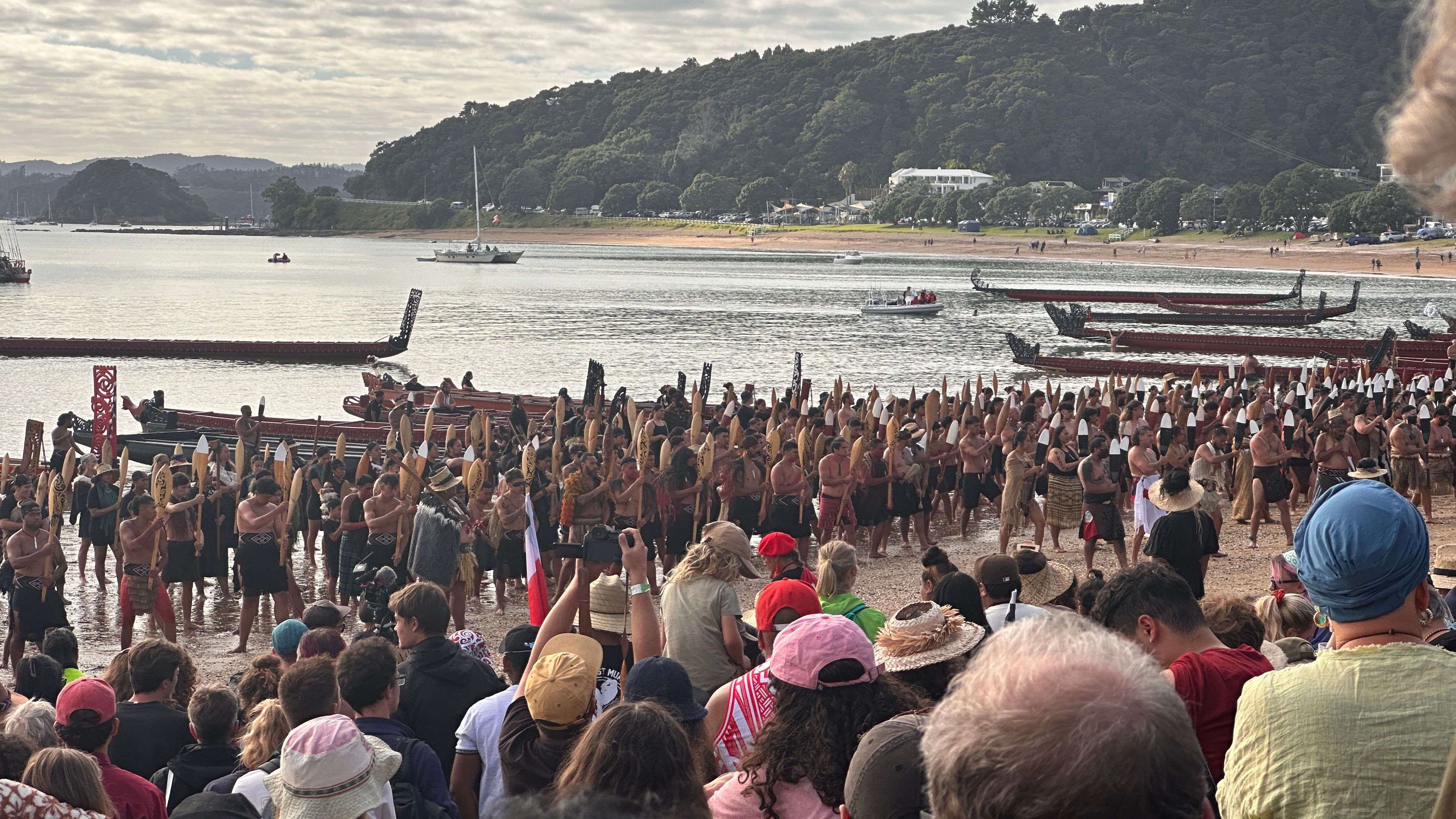 Kaihoe perform karakia before departing Te Tii Beach. Photo/PMN News/Atutahi Potaka-Dewes