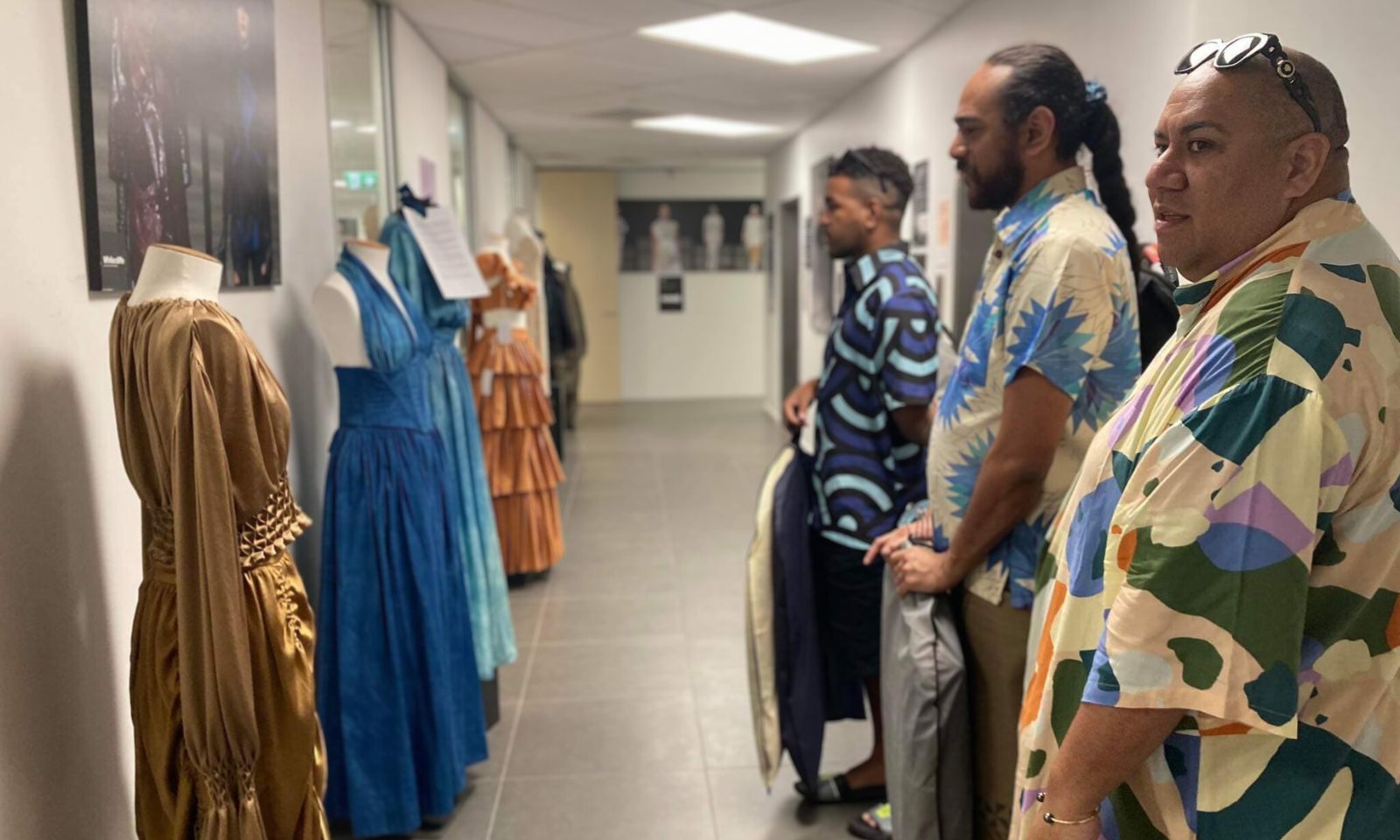 Fiji Fashion designer and co-founder of Wearing Fiji Samson Lee (foreground) with Aisea Solomone and Ledua Daurewa walking a hall of one of NZ's fashion and design schools. Photo/Pacific Connections MFAT Facebook