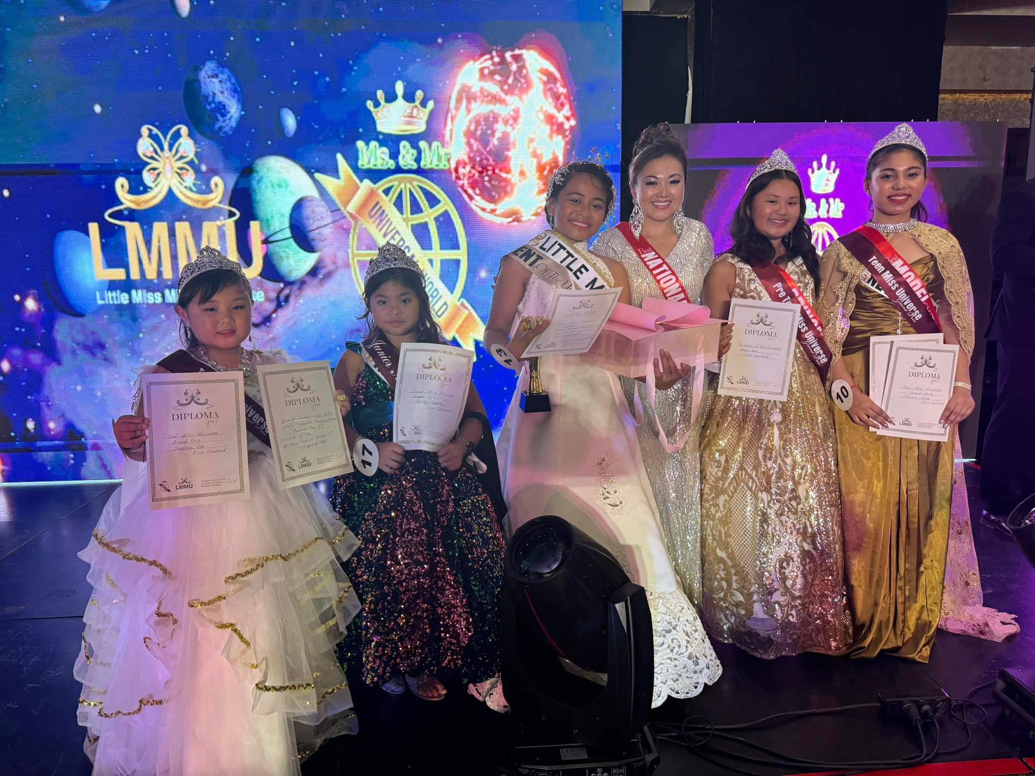 The New Zealand team at the crowning ceremony of Little Miss and Mister Universe 2024. (From left to right) YoonHee Seo, Harley Caballes, Tapaita Fonokalafi, Kogi So, YoonJi Seo, and Flounna Mosa. Photo/Supplied