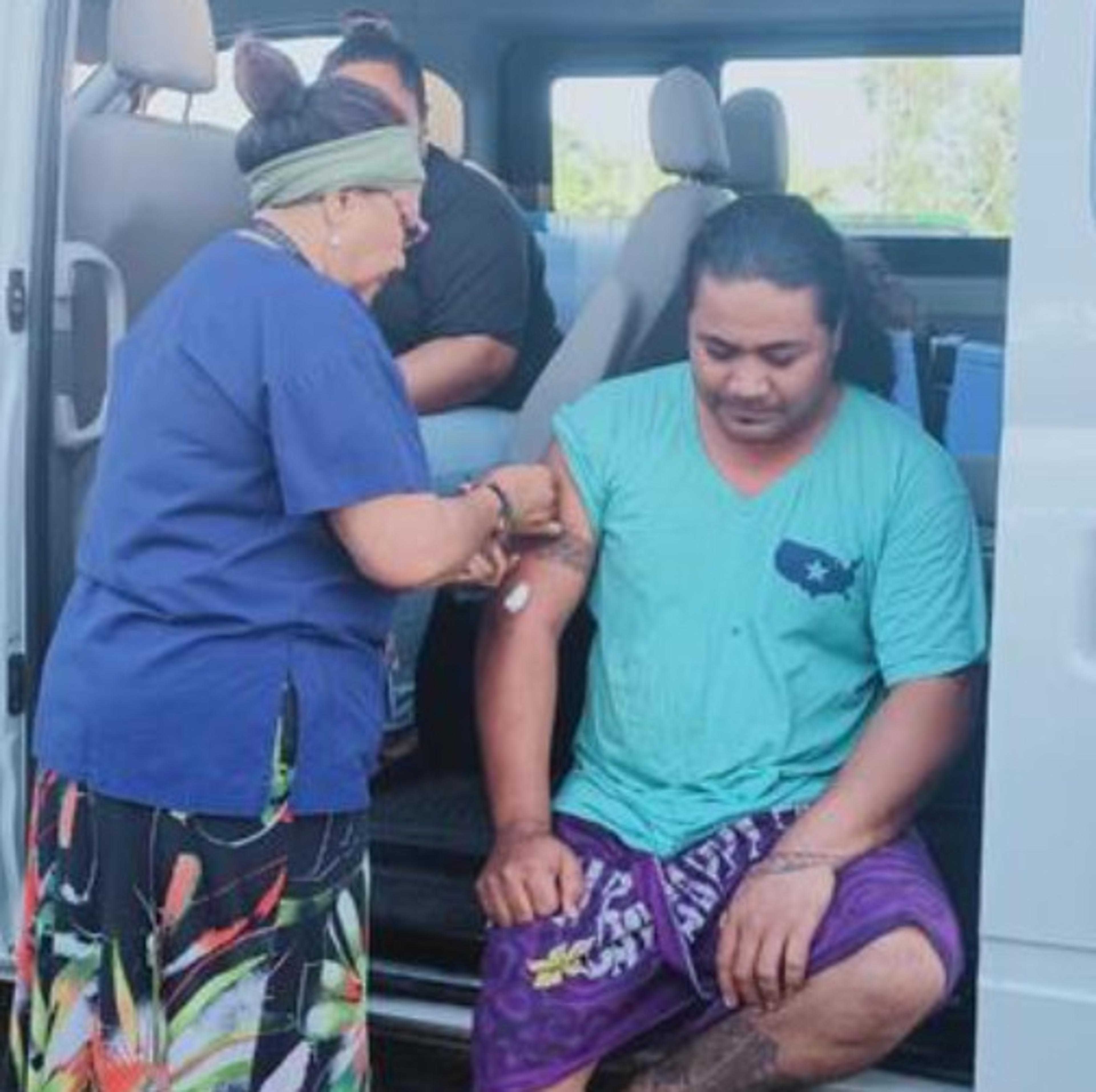 A nurse administers a shot during the mass vaccination campaign.           