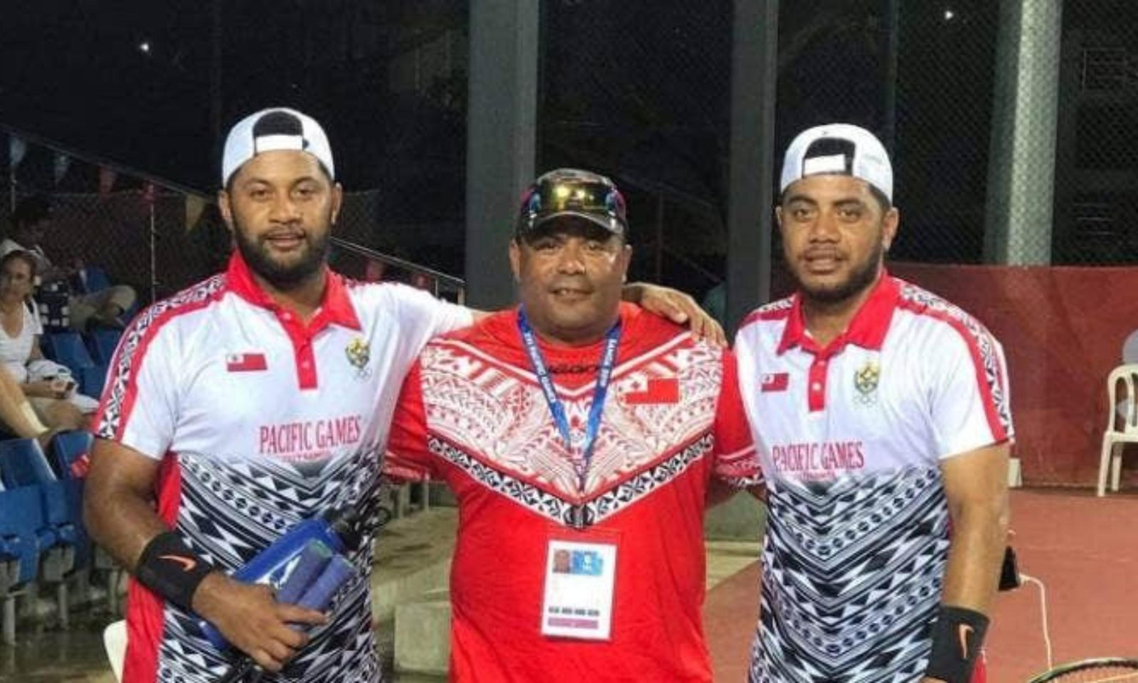 Matavao, right, and Semisi Fanguna, left, pictured with their coach after they won Tonga’s first gold medal in tennis at the 2019 South Pacific Games.