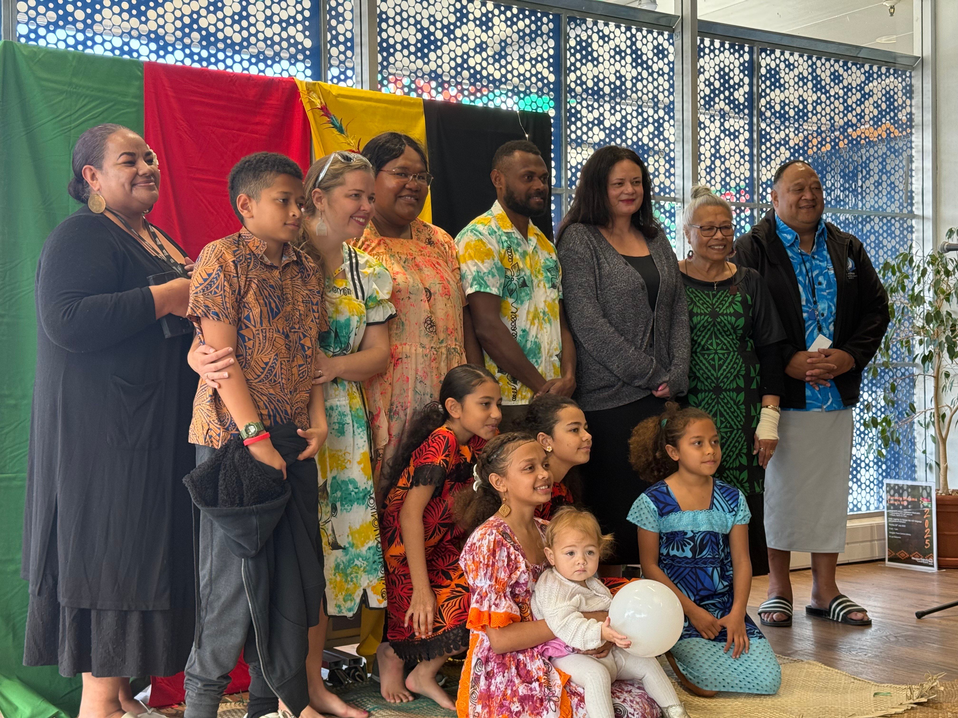 Eric Lingbu (centre) with his family, members of the Auckland Vanuatu Community, and Māngere Town Centre Library Pacific staff. Photo/Atutahi Potaka-Dewes