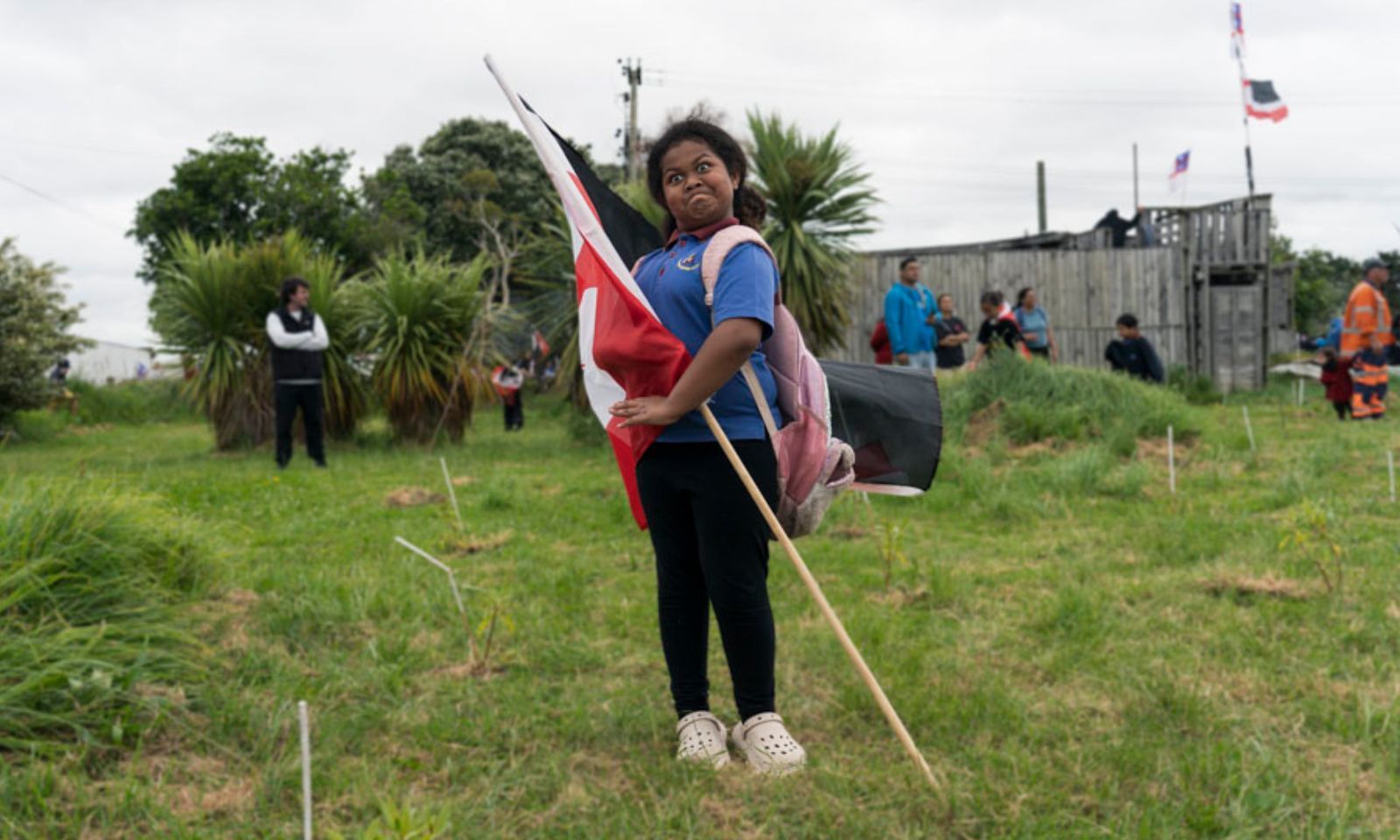 ‘It feels like family’: Multi-ethnic people with their flags for Hīkoi mō Te Tiriti