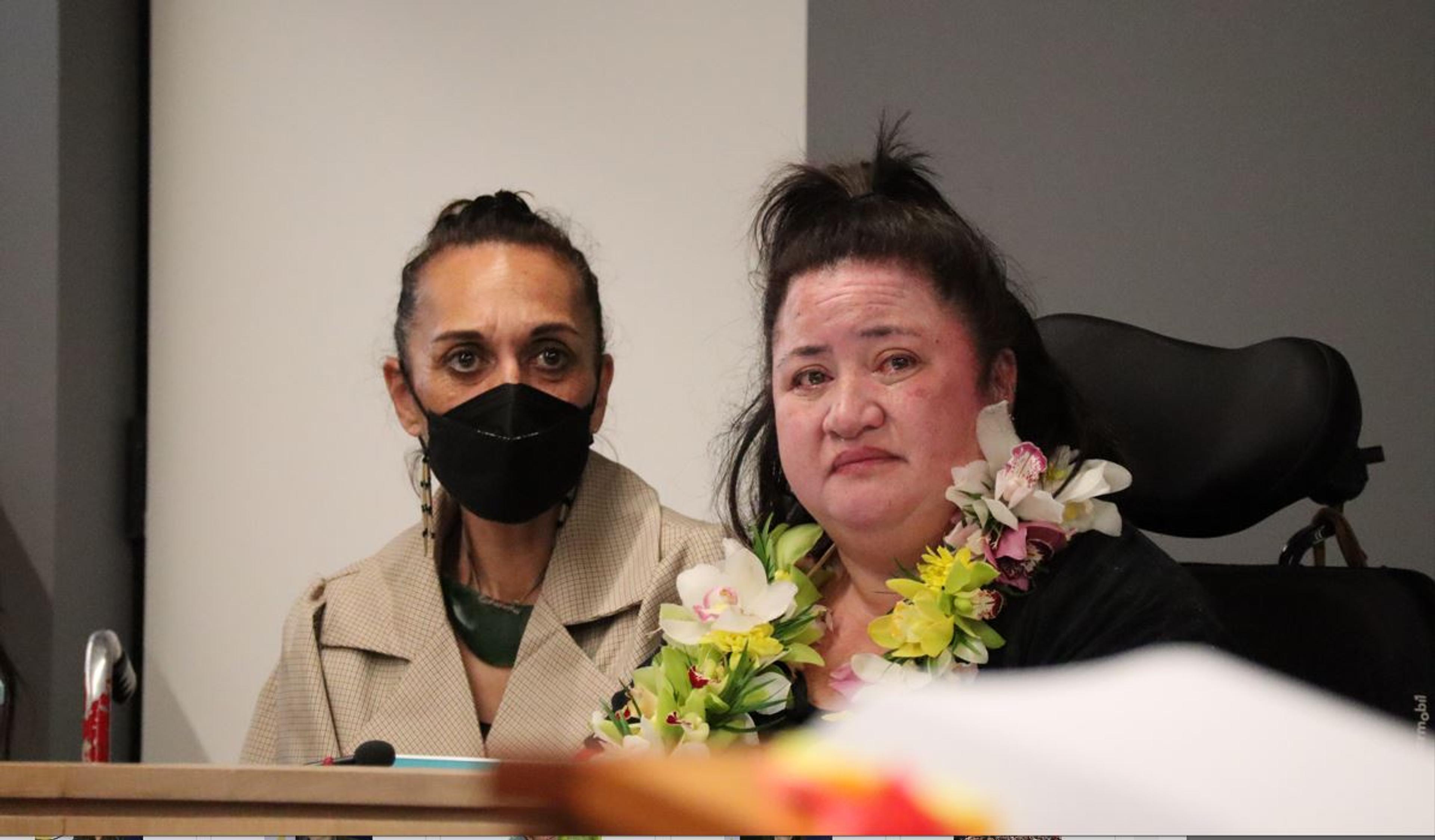 Lusi Faiva as her statement is read at the Abuse in Care inquiry, with support person Dr Kelly Tikao by her side. ​Photo / Royal Commission