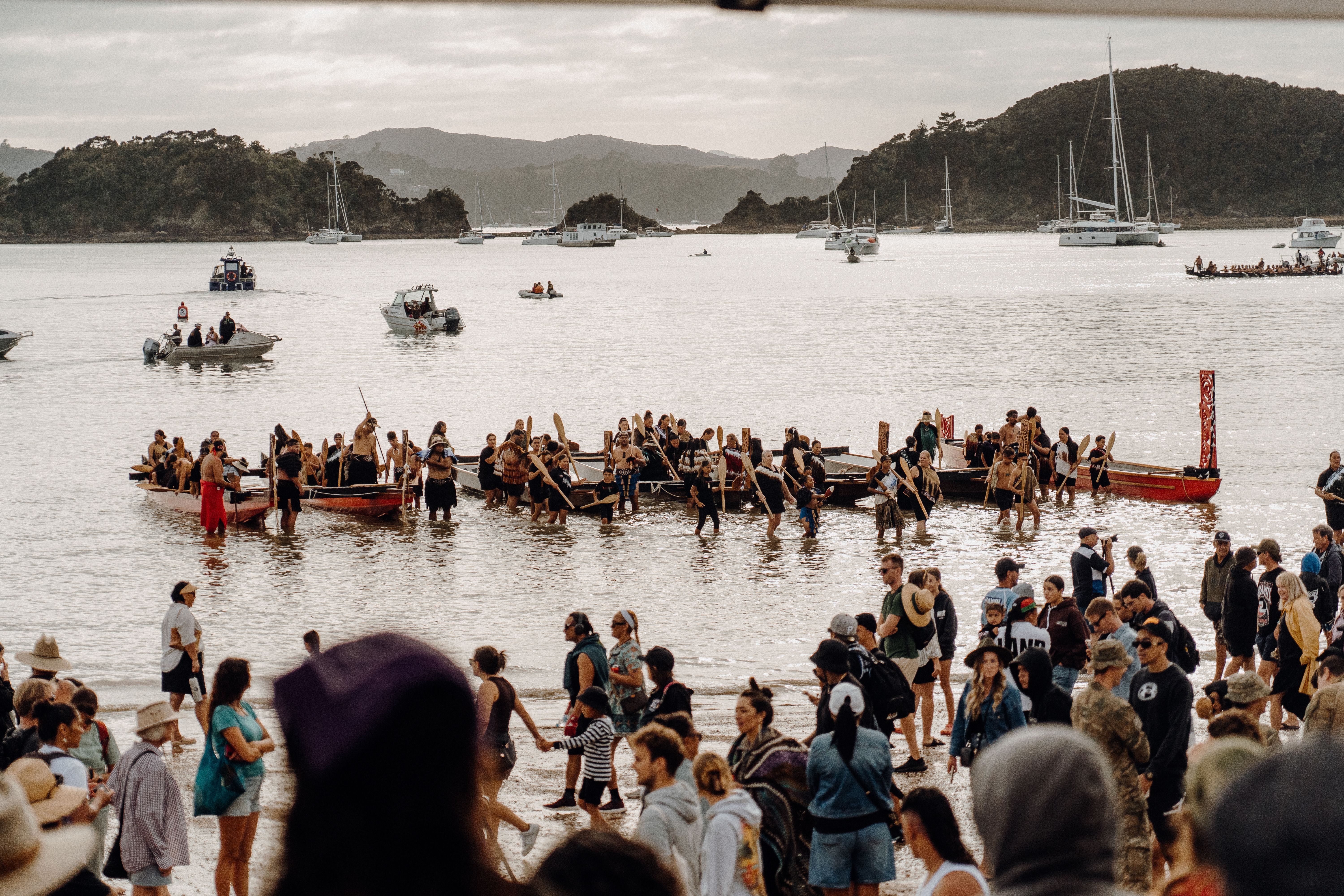 Waka being hauled to shore at Te Tii Beach. Photo/Joseph Safiti