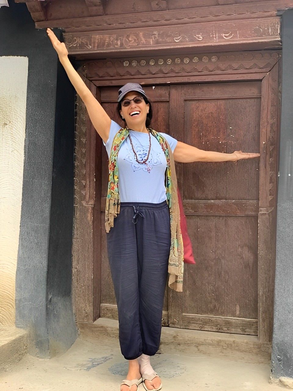 susan turis doing yoga arm balance pose