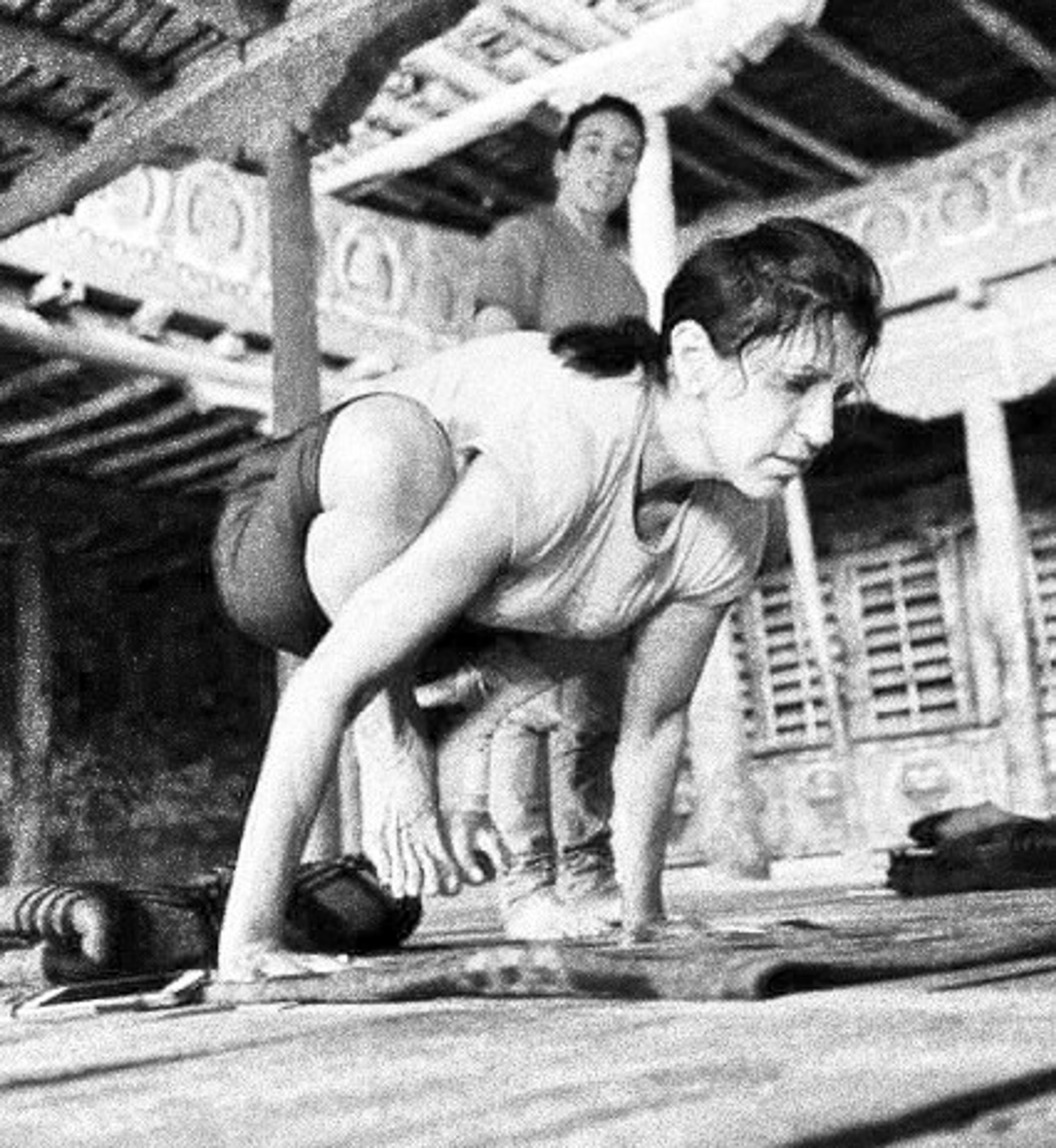 susan turis doing yoga arm balance