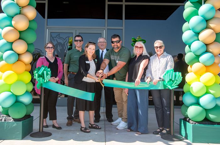 Mustang Business Park staff members cut the ribbon with the help of Cal Poly President Jeffrey Armstrong.