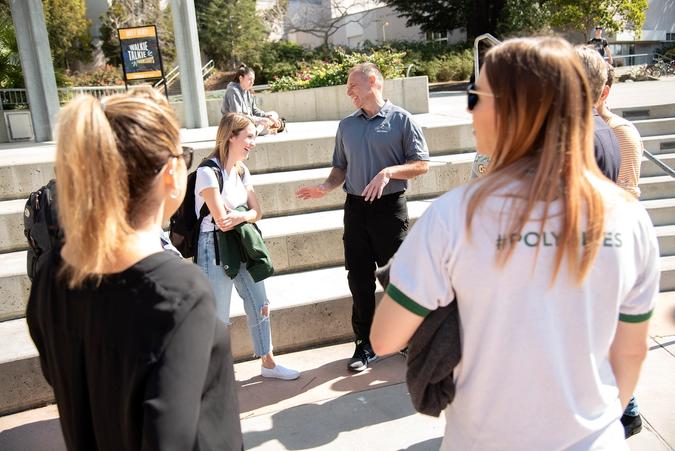 Assistant Vice President/Chief of Police George Hughes laughs with a student.