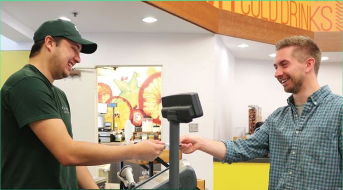 Student Paying For Meal