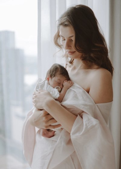 Parents sharing a quiet moment with their newborn baby at home