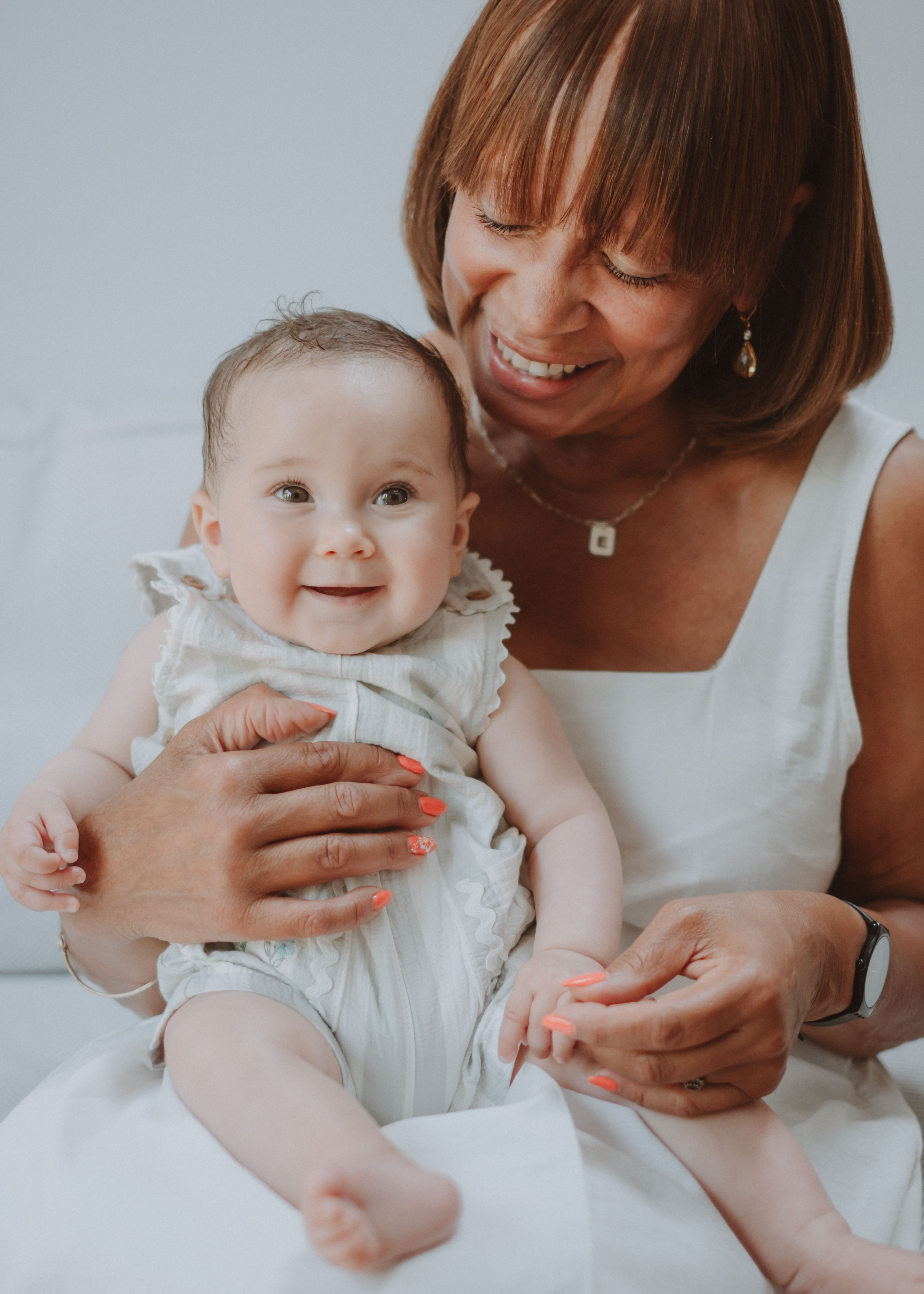 Newborn baby cradled by their parents during a relaxed family photography session