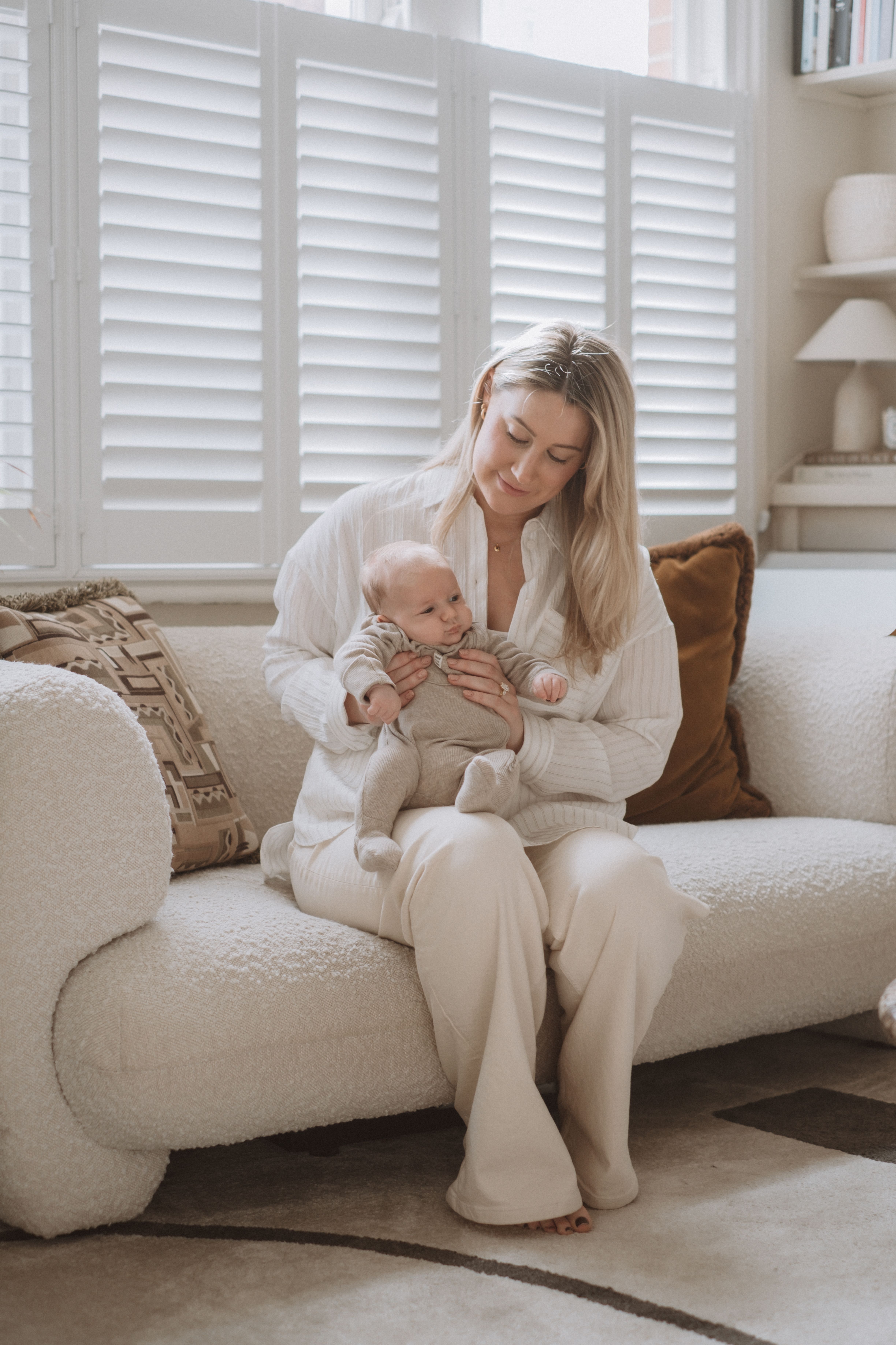 Parents sharing a quiet moment with their newborn baby at home
