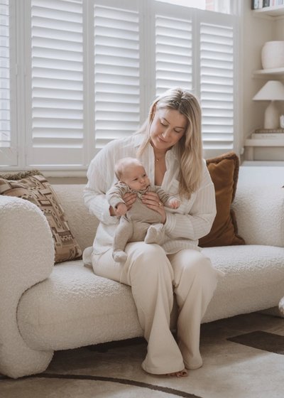 Parents sharing a quiet moment with their newborn baby at home