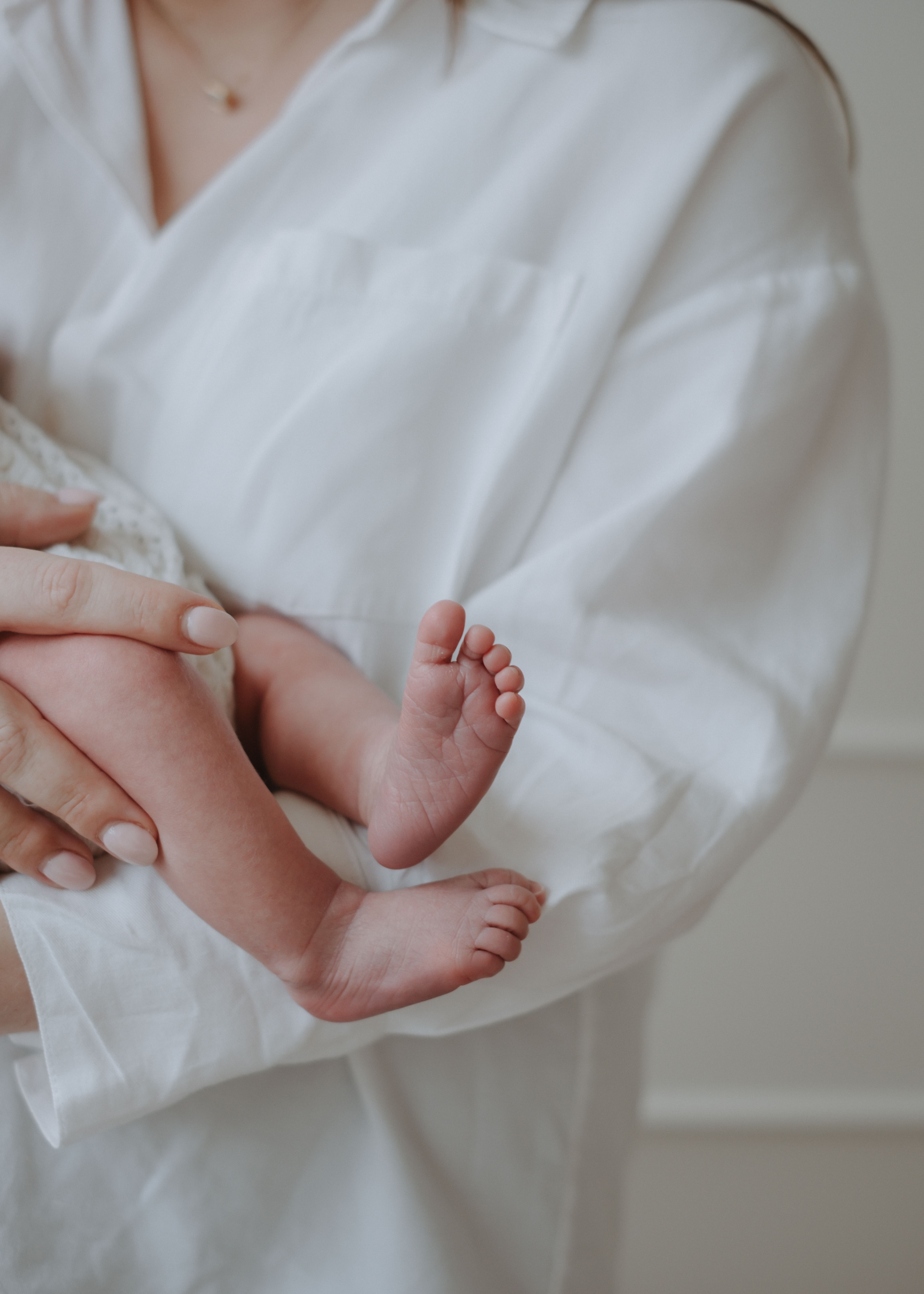 Parents sharing a quiet moment with their newborn baby at home