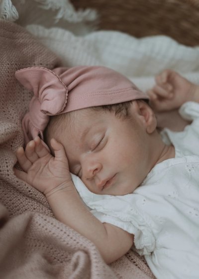 Newborn baby resting peacefully during a natural at-home photography session in London