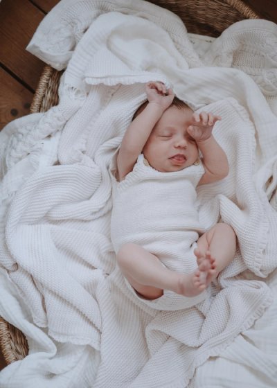 Newborn baby awake and looking towards the camera at home