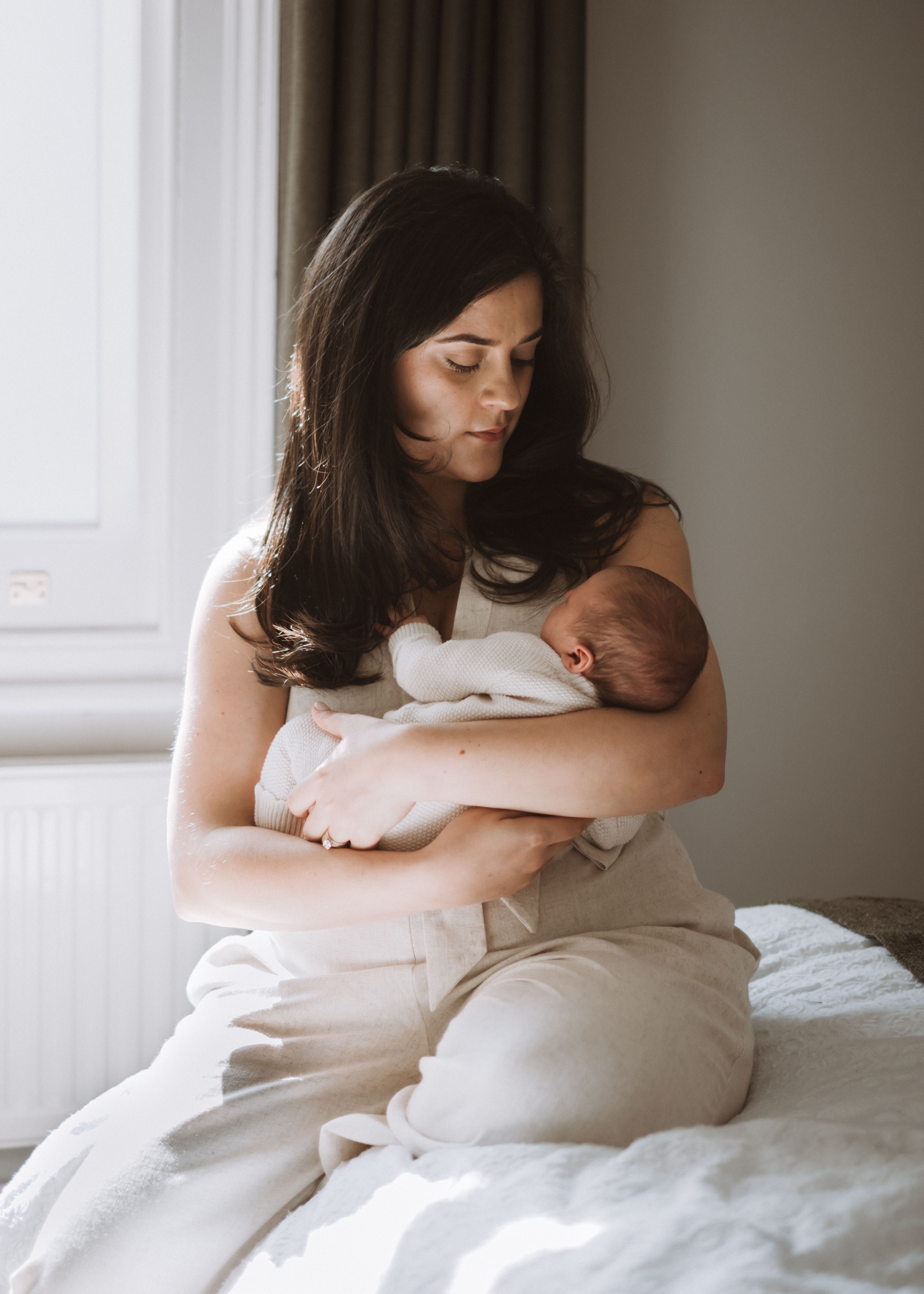 Newborn baby awake and looking towards the camera at home