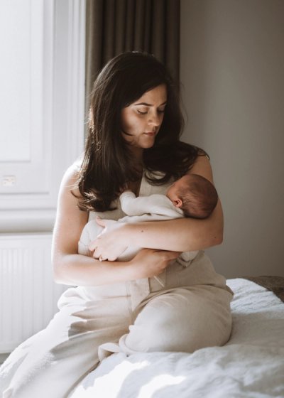 Newborn baby awake and looking towards the camera at home