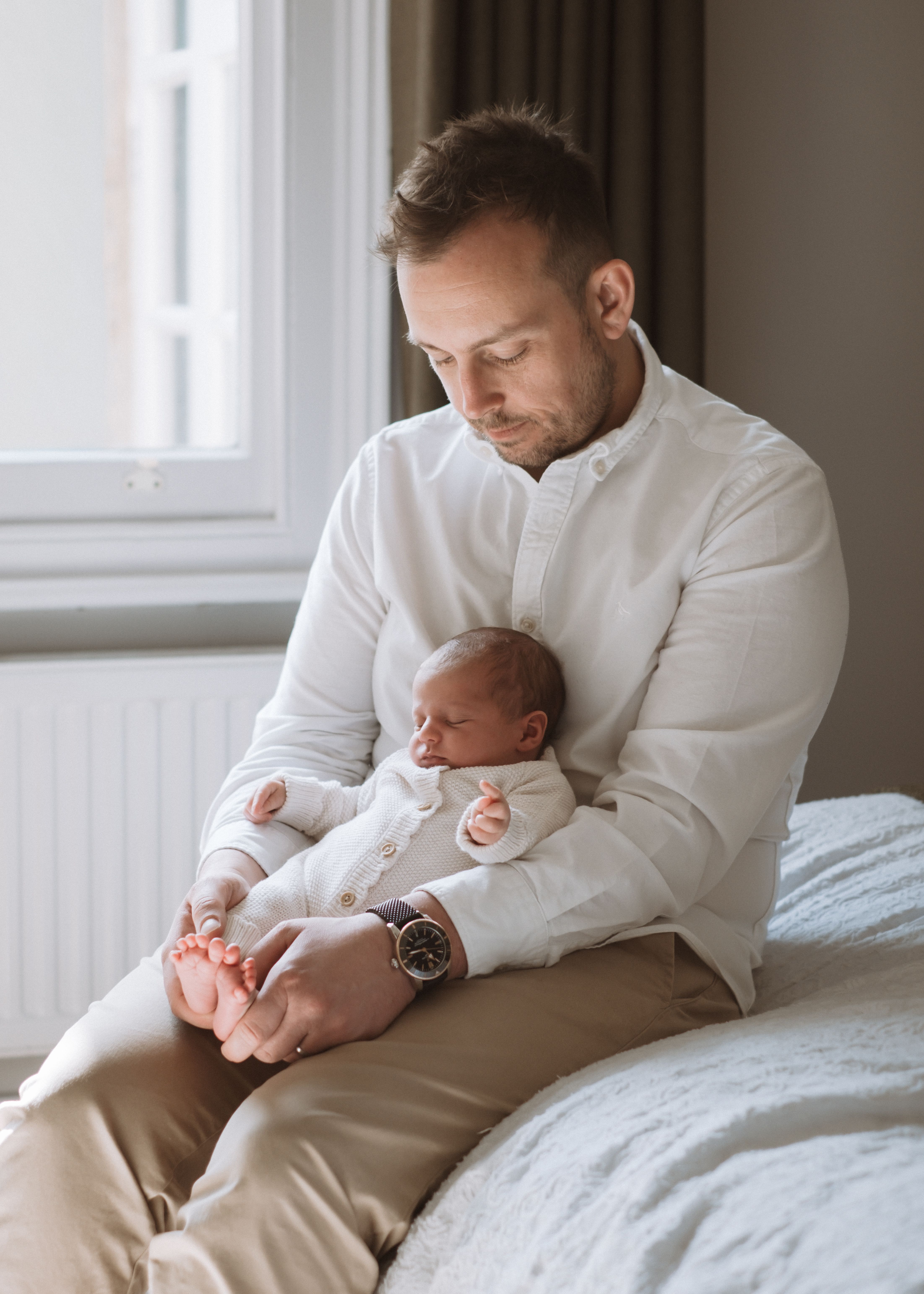 Newborn baby resting peacefully during a natural at-home photography session in London