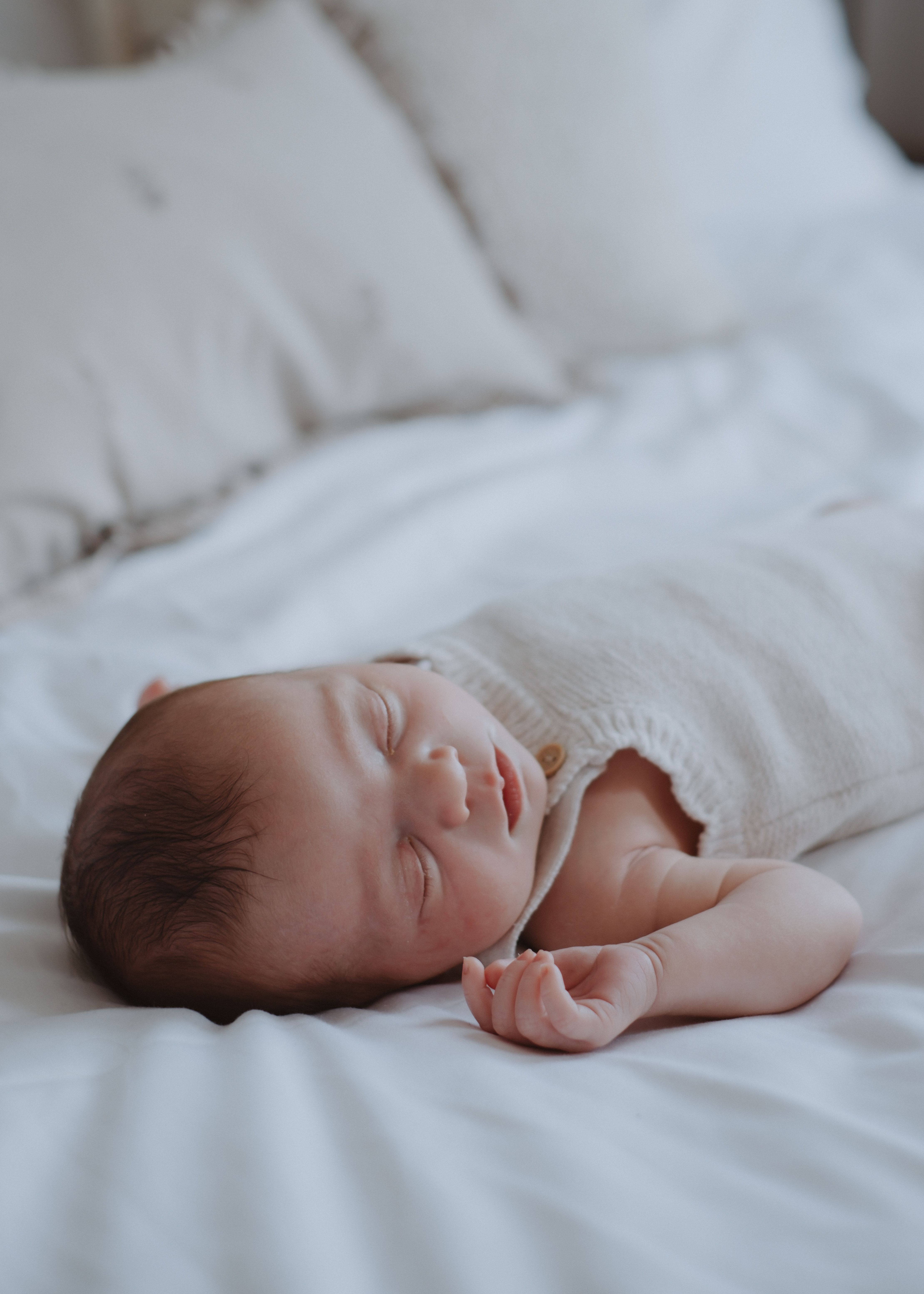 Newborn baby resting peacefully during a natural at-home photography session in London