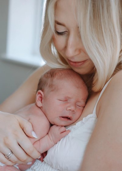 Newborn baby awake and looking towards the camera at home