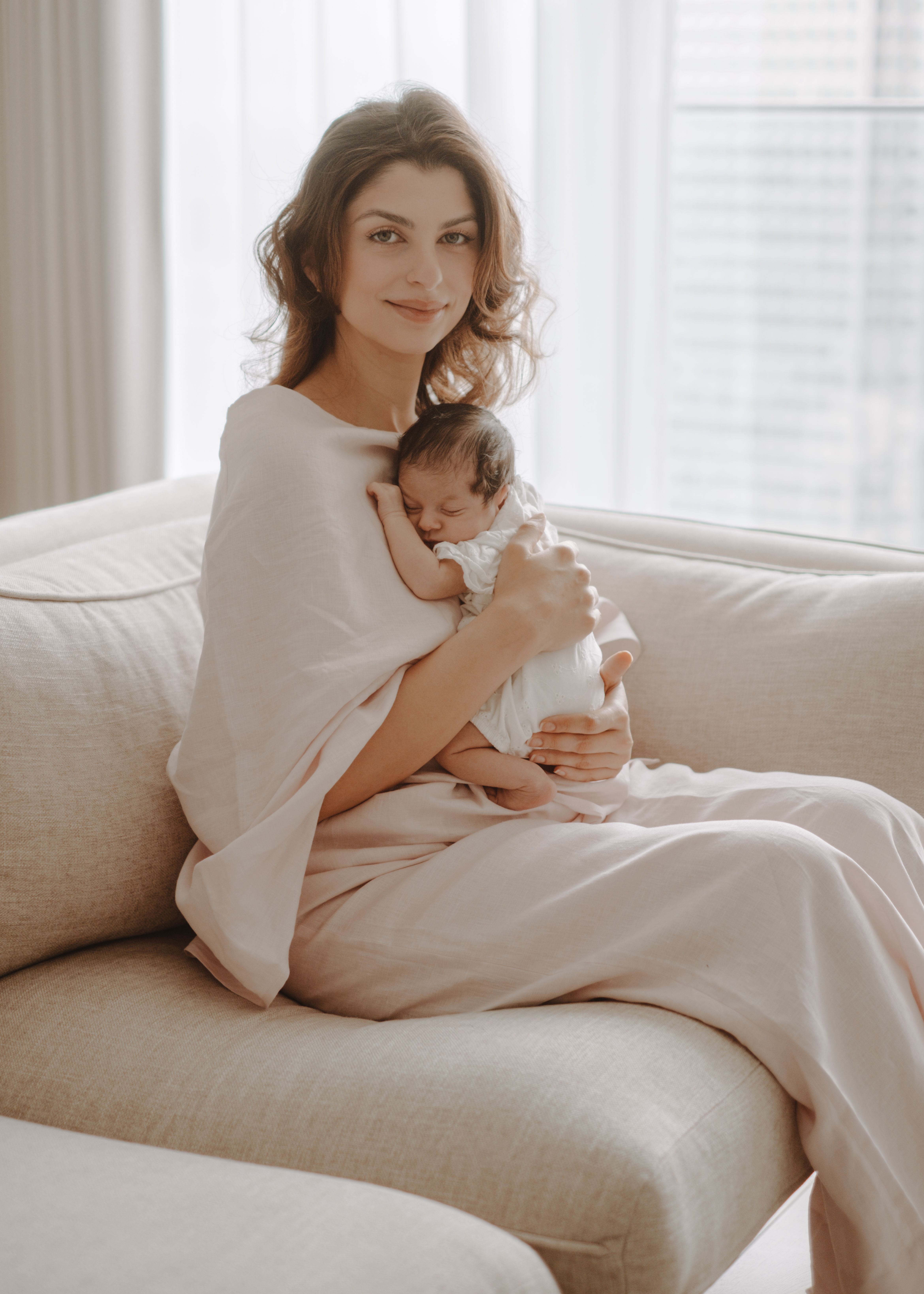 Newborn baby awake and looking towards the camera at home