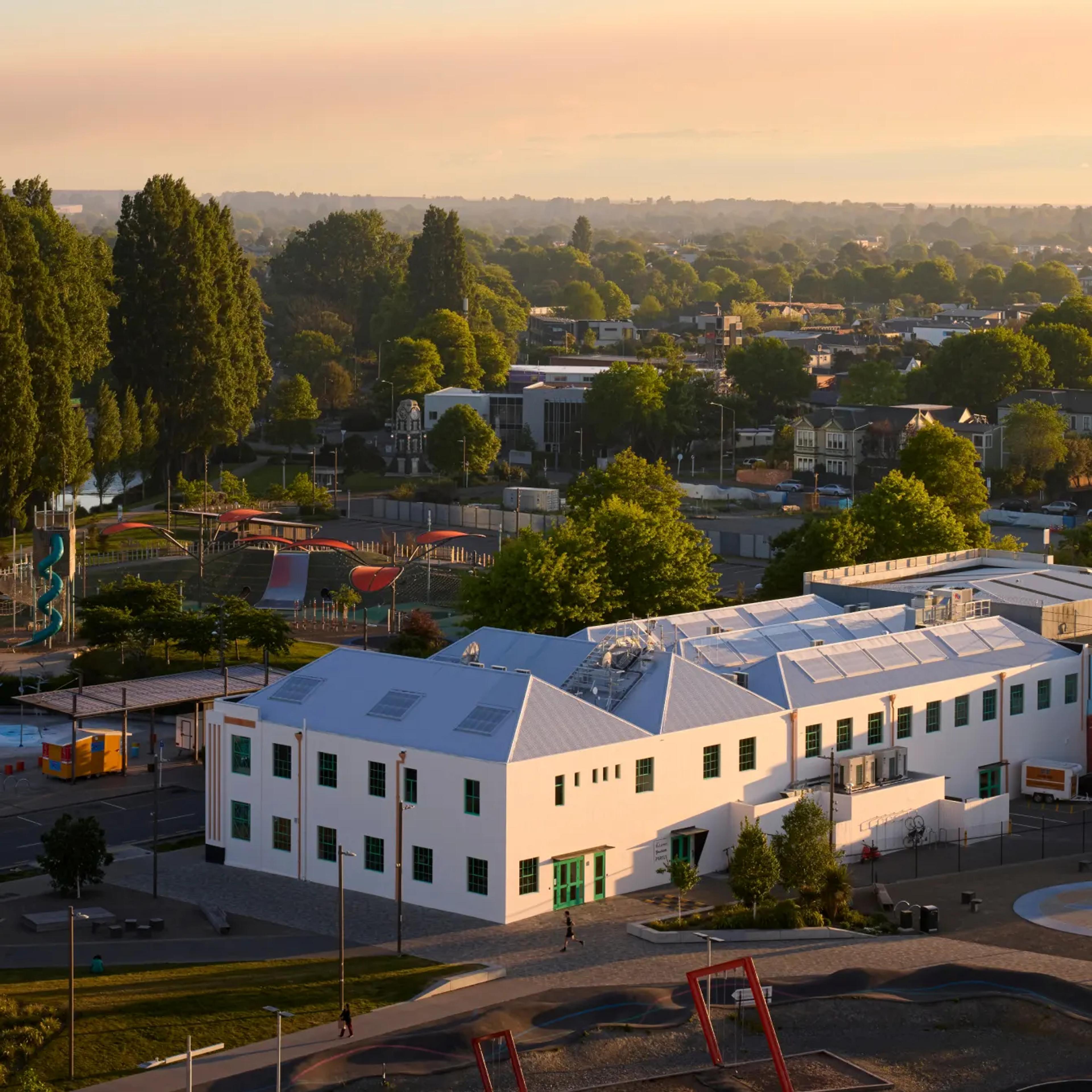 Aerial view of the Lumin office building at sunset