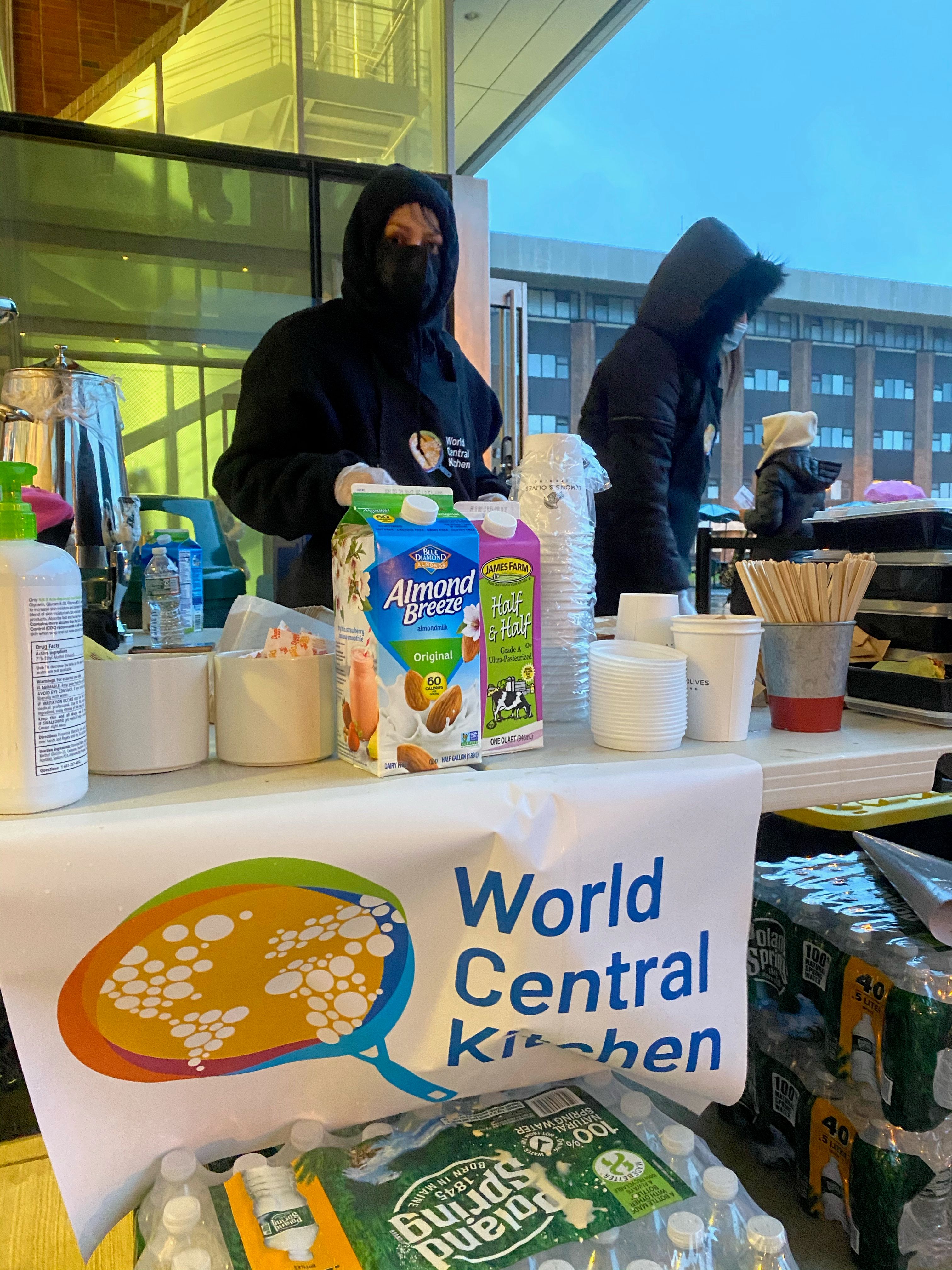 Emergency catering setup providing food and beverages for community relief efforts with World Central Kitchen.