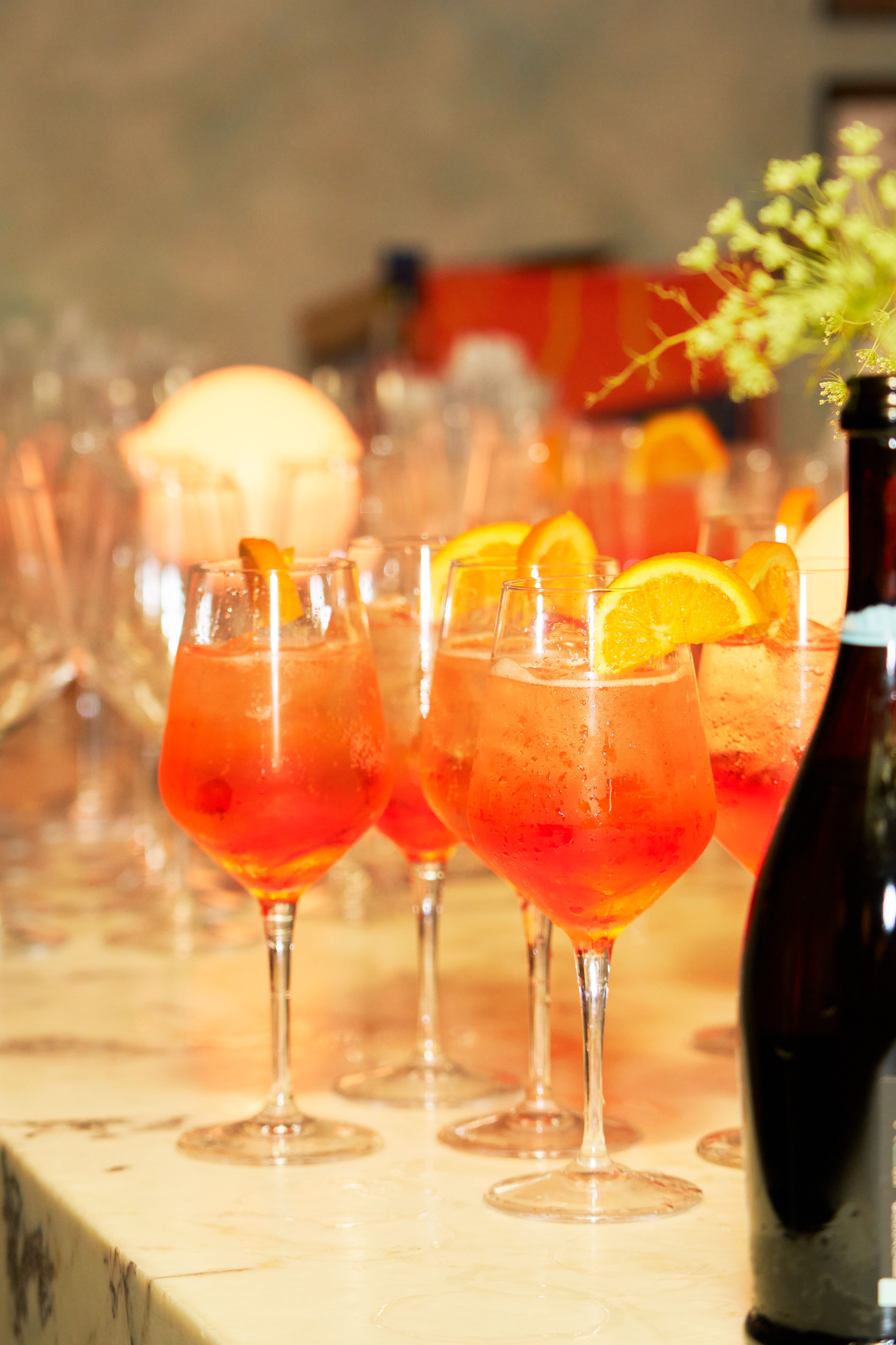 Signature cocktails being poured at a luxury experiential marketing event.