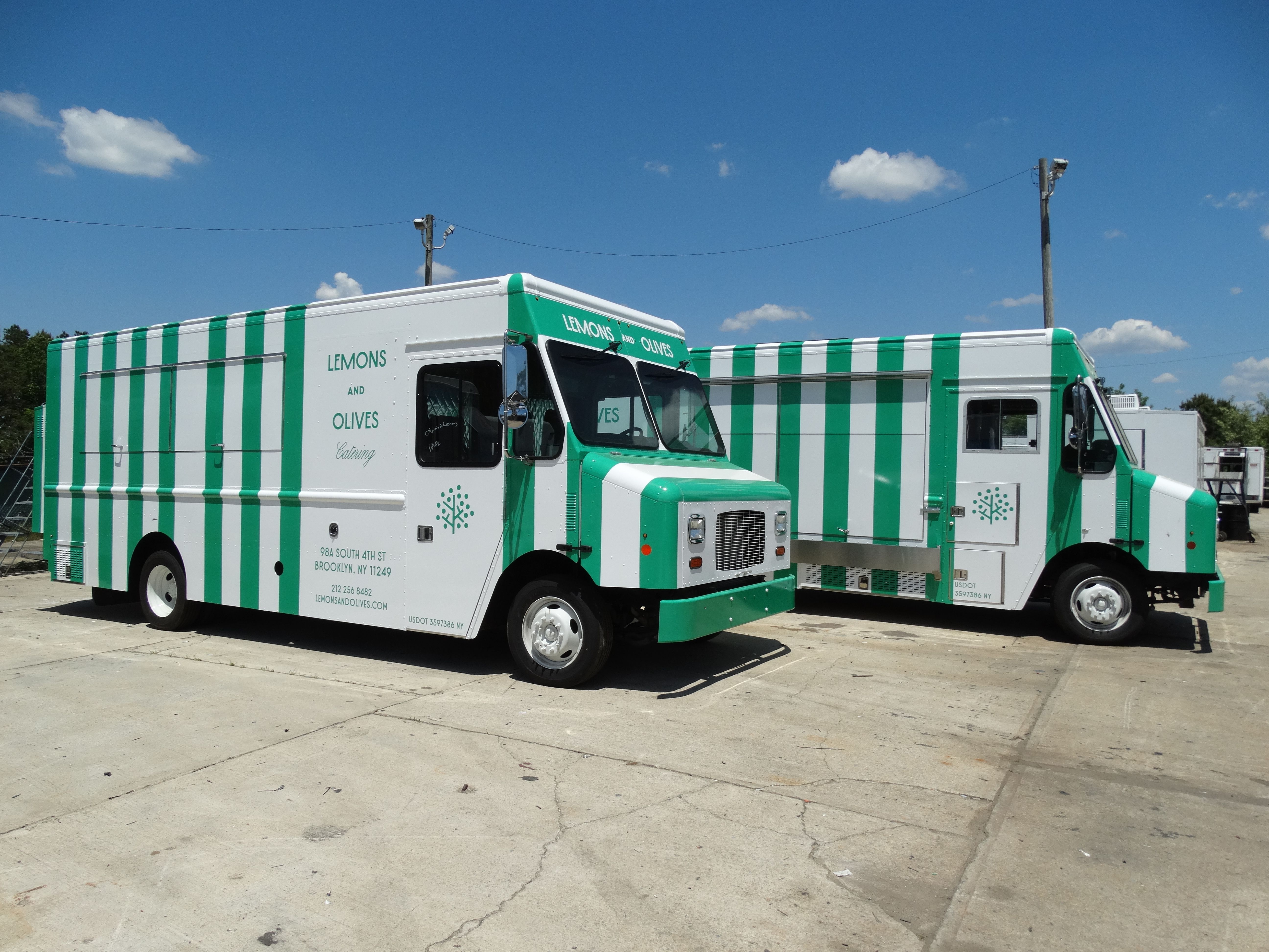 Two Lemons and Olives mobile catering kitchen trucks used for film production, events, and large-scale catering.