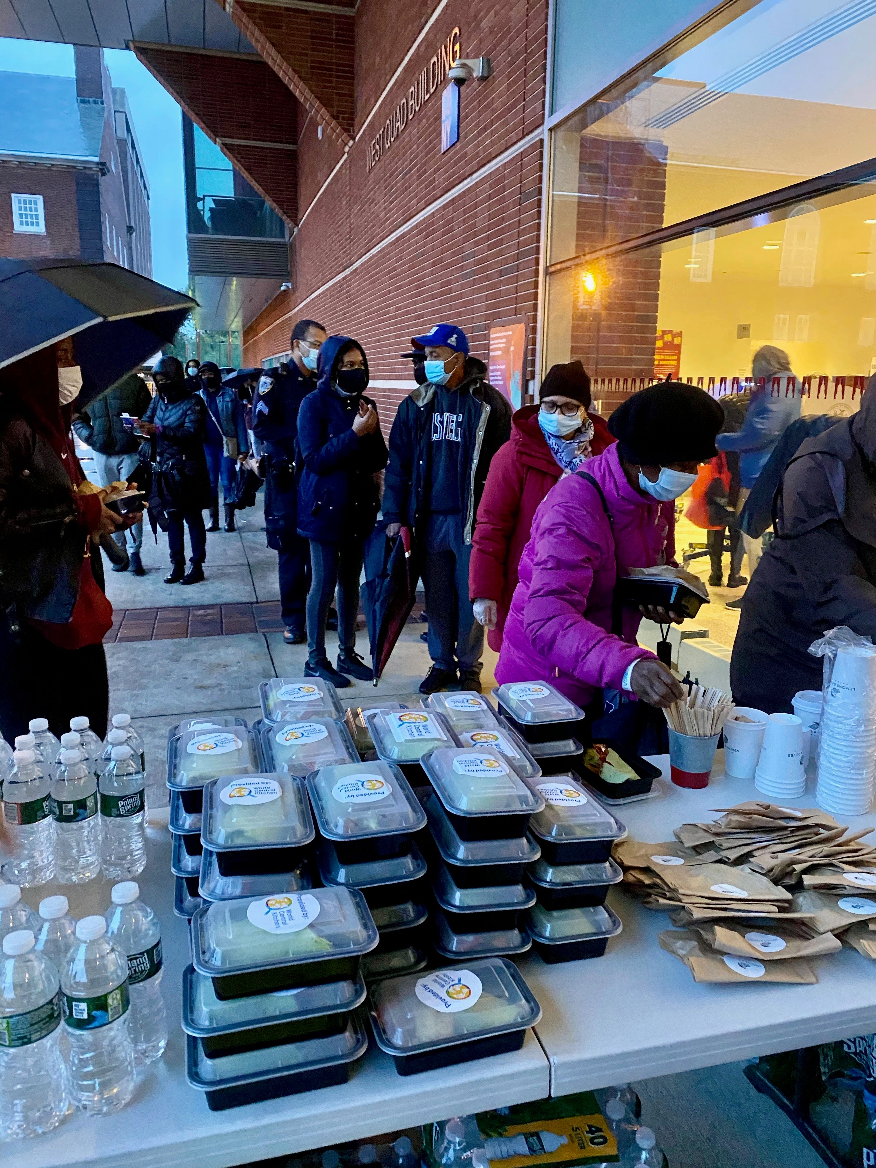 Lemons and Olives distributing packaged meals and water during emergency community food service.