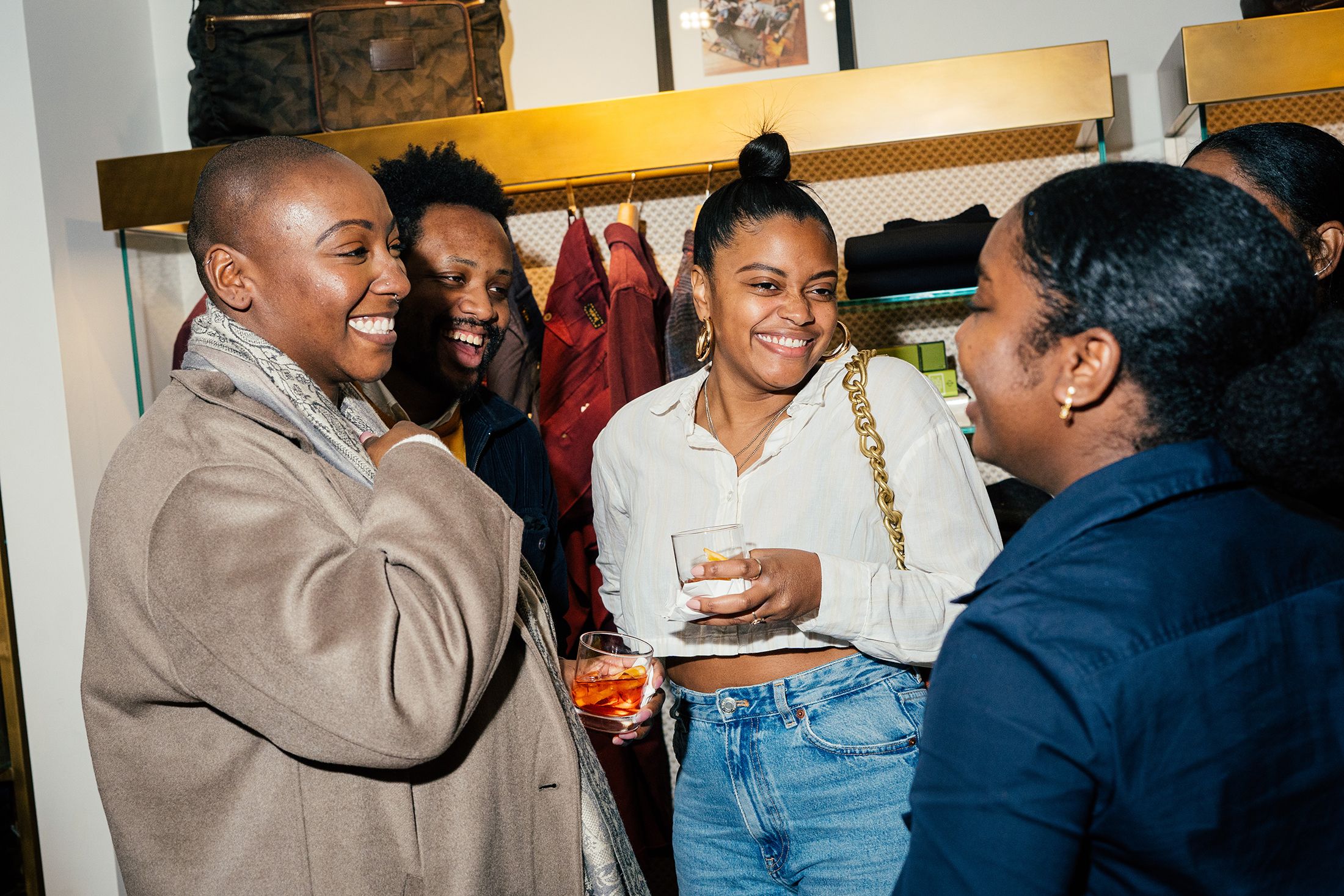 Guests socializing with cocktails during a corporate event cocktail hour reception.