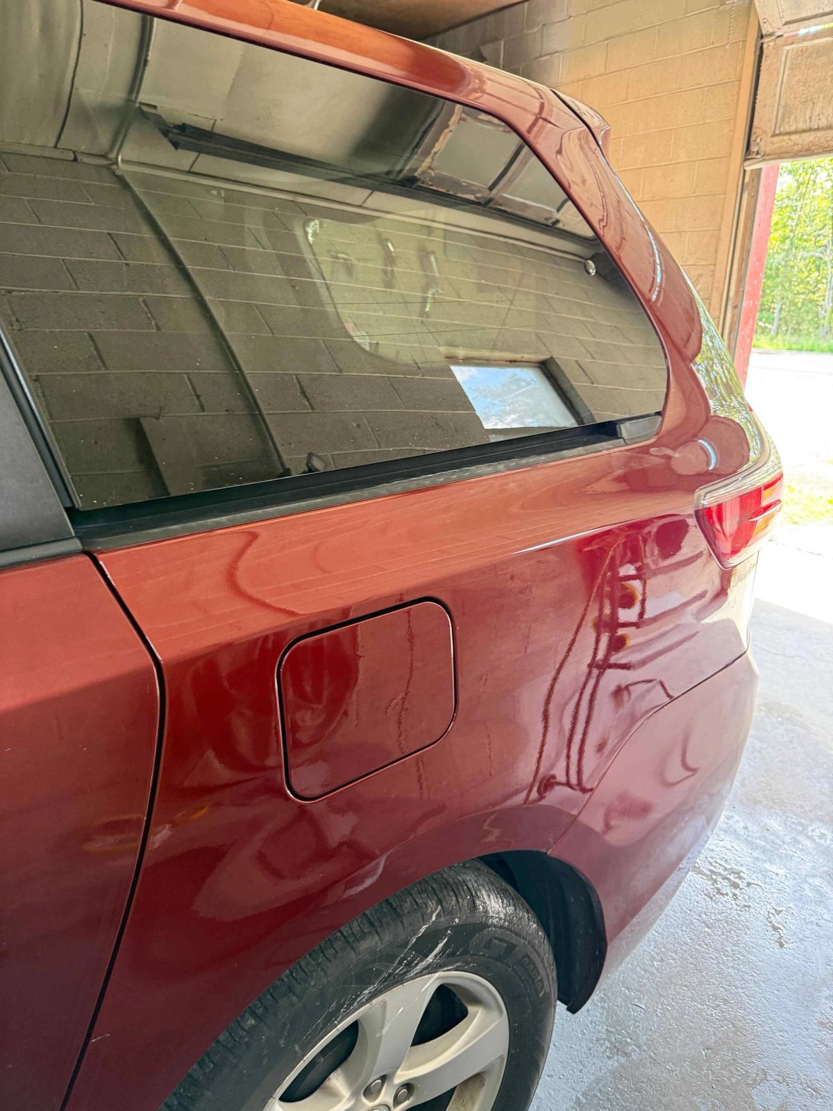 Rear quarter panel after collision repair with restored factory body lines