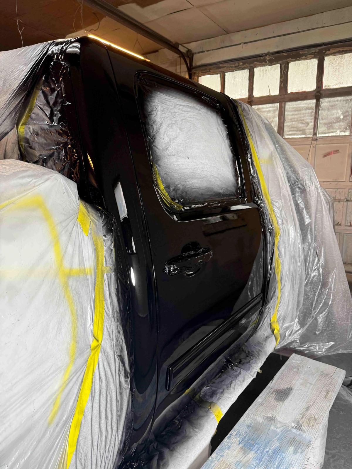 Truck door after paint repair showing a seamless blended color match