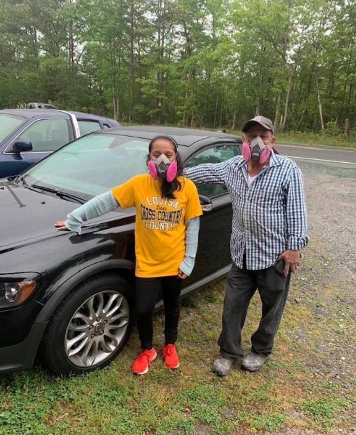 In & Out Autobody technicians standing outside the Gordonsville auto body shop