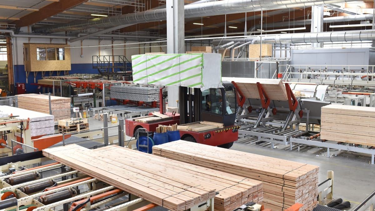 Automated production line moving finished lumber through a mill