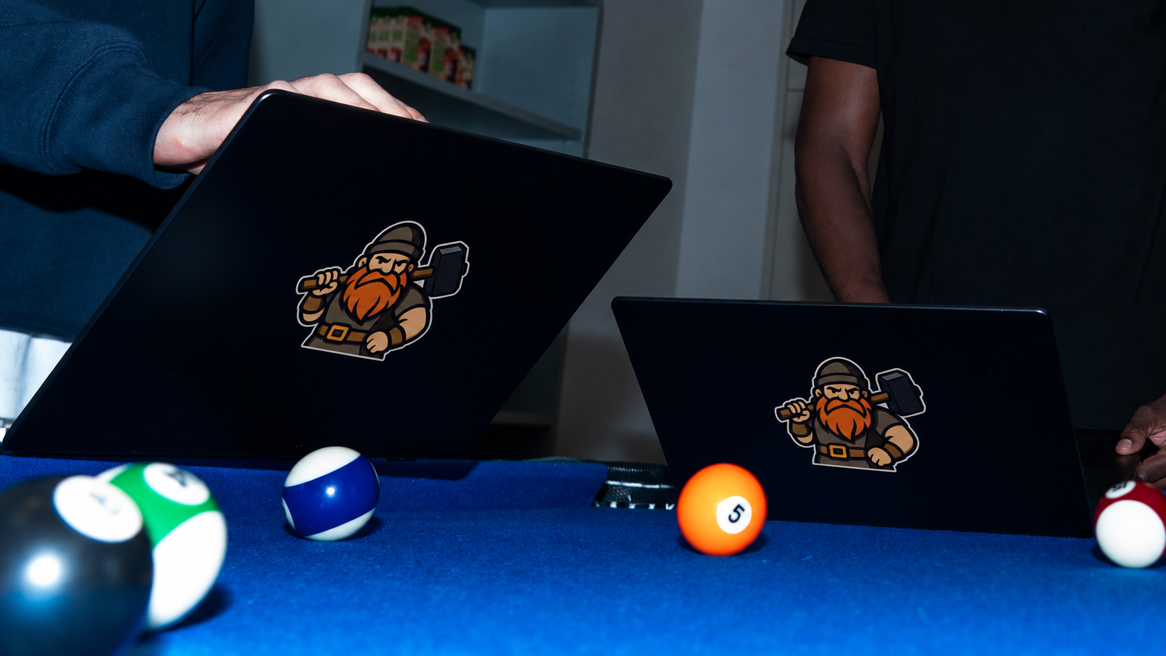 Laptops on pool table