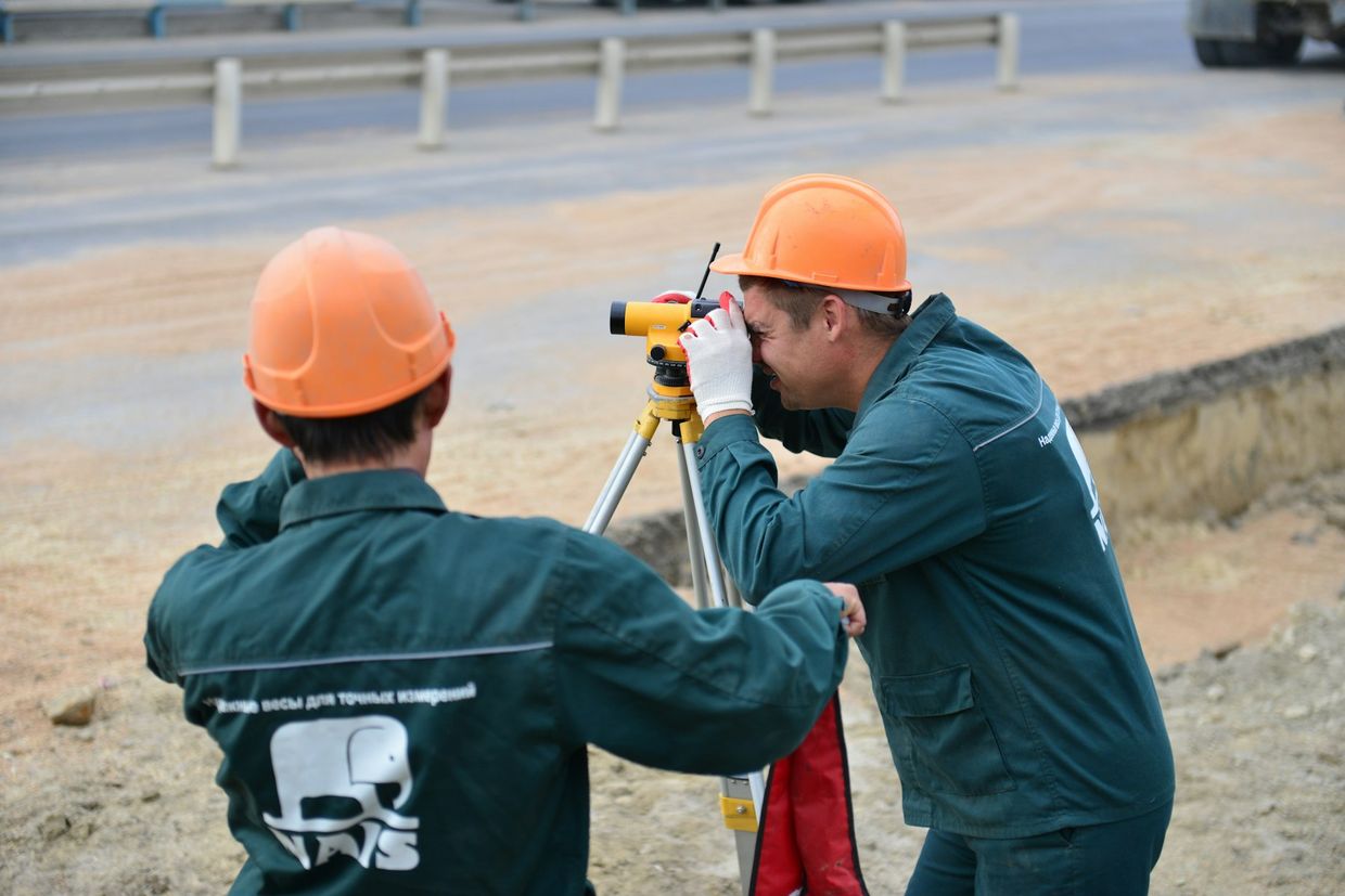 Survey team working together on site