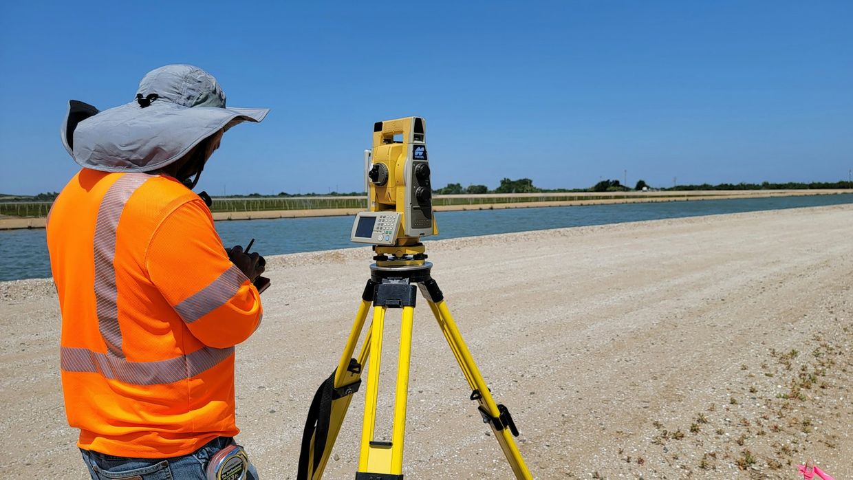 Surveyor marking a boundary corner