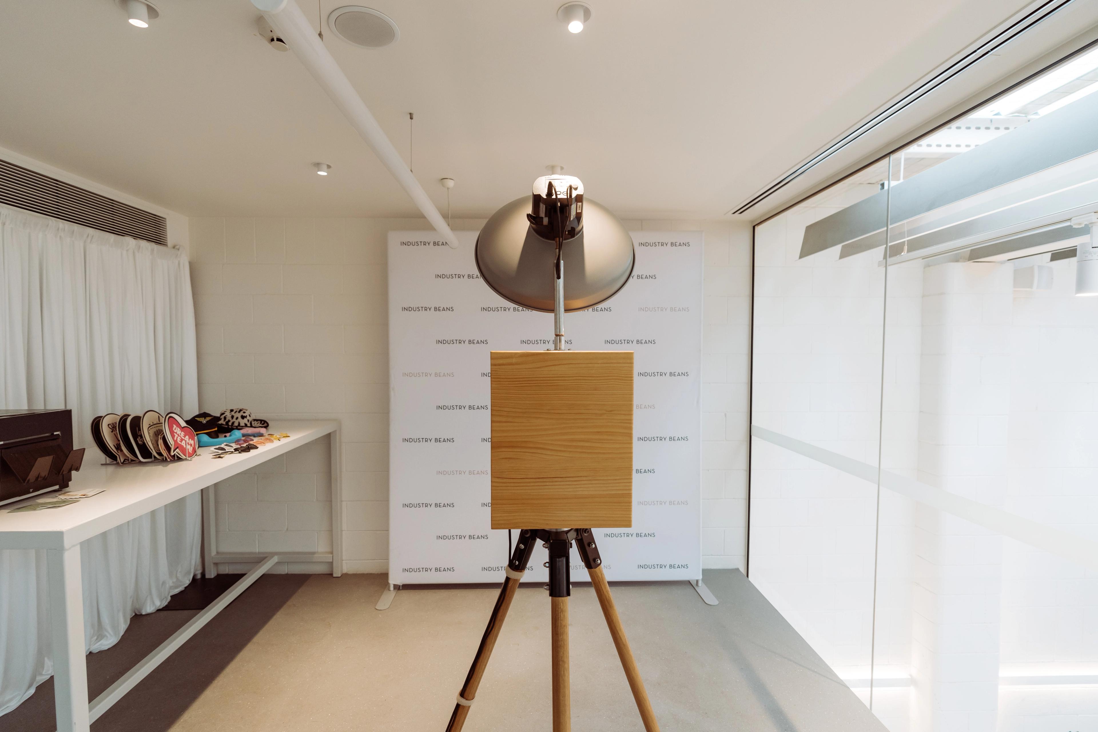 Photo booth setup with Industry Beans media wall and props for the Newstead brand activation in Brisbane.