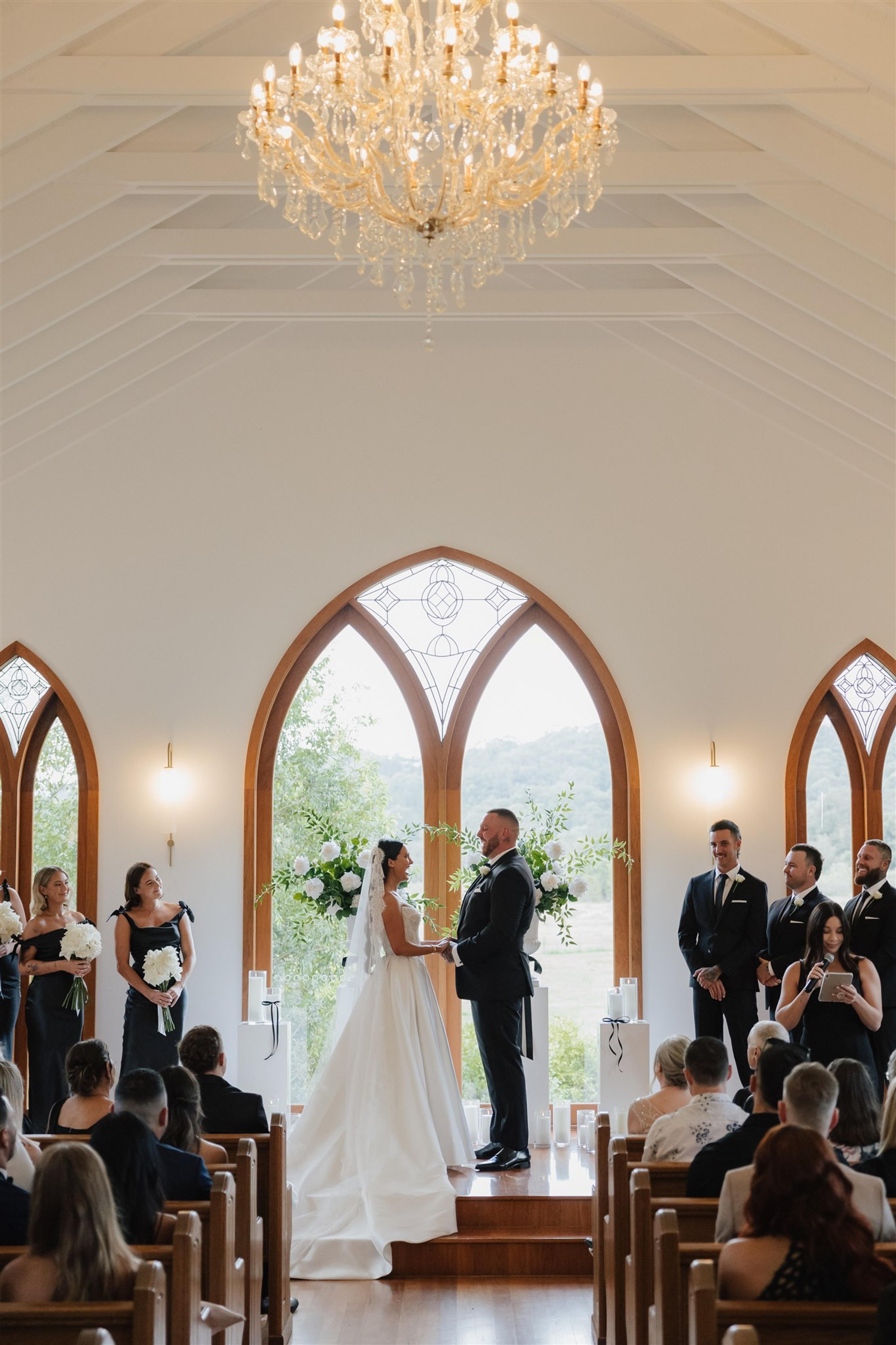 Rochelle and Jeff standing at the altar during their wedding ceremony at The Valley Estate Gold Coast.
