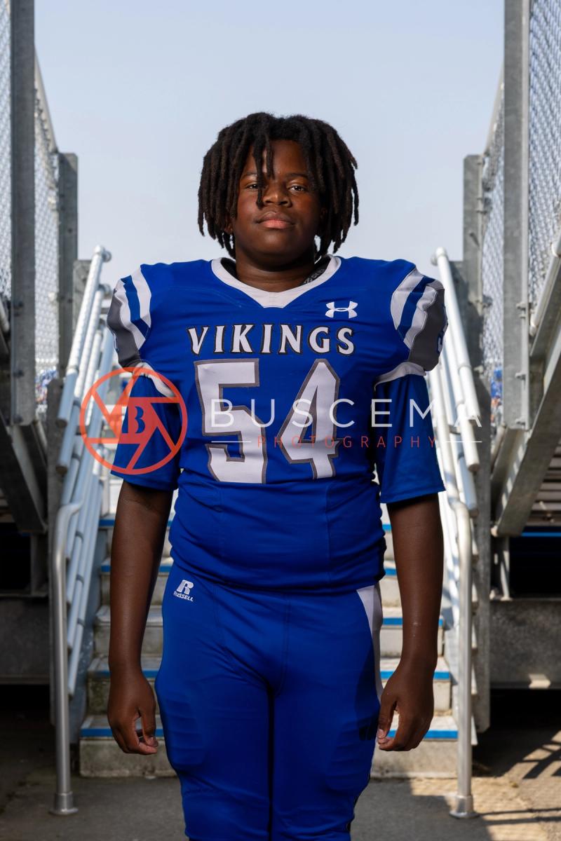 Coeur d'Alene High School football player in a number 54 Vikings jersey